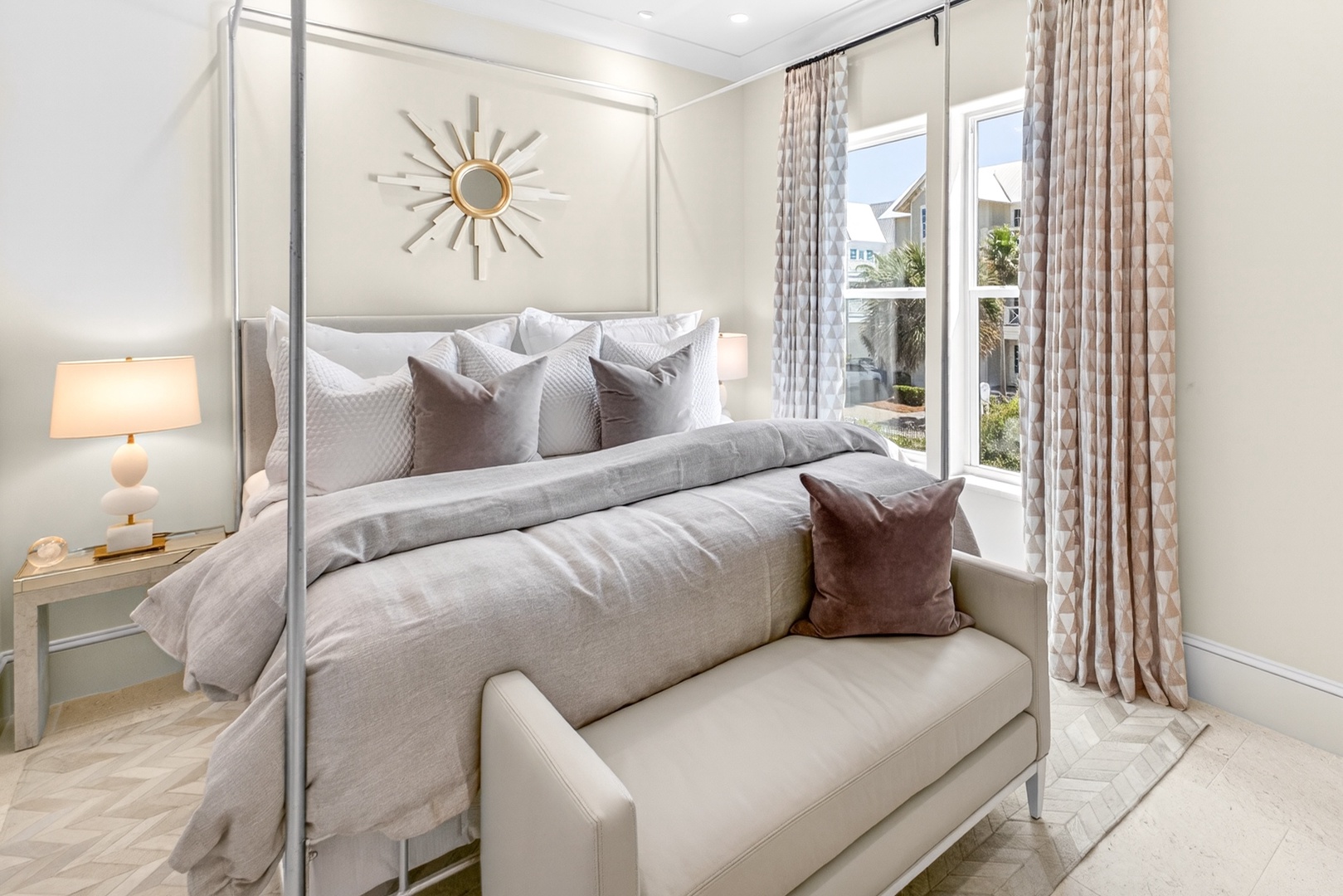Slip into plush linens and wake to sunlight streaming through your windows. This serene bedroom blends elegant textures with cozy comfort, creating your perfect retreat.
