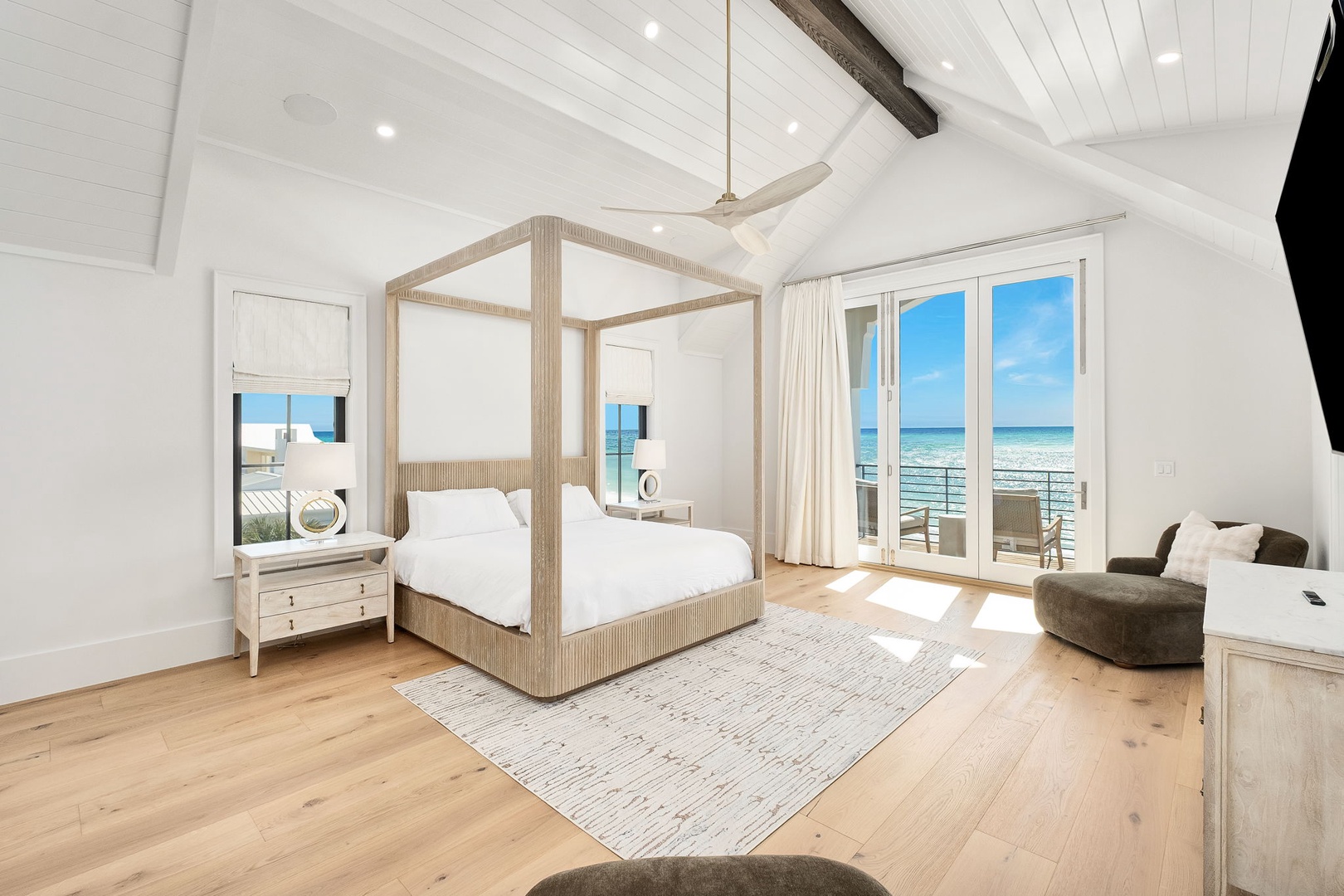 Wake up to stunning ocean views from your elegant four-poster bed, with the beach just steps from your private balcony door.