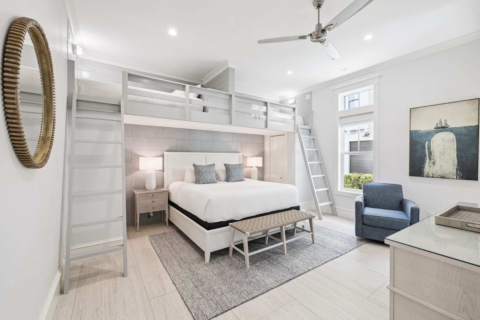 Unwind in your sophisticated bedroom featuring custom bunk beds, plush seating, and thoughtful coastal design details for ultimate comfort.
