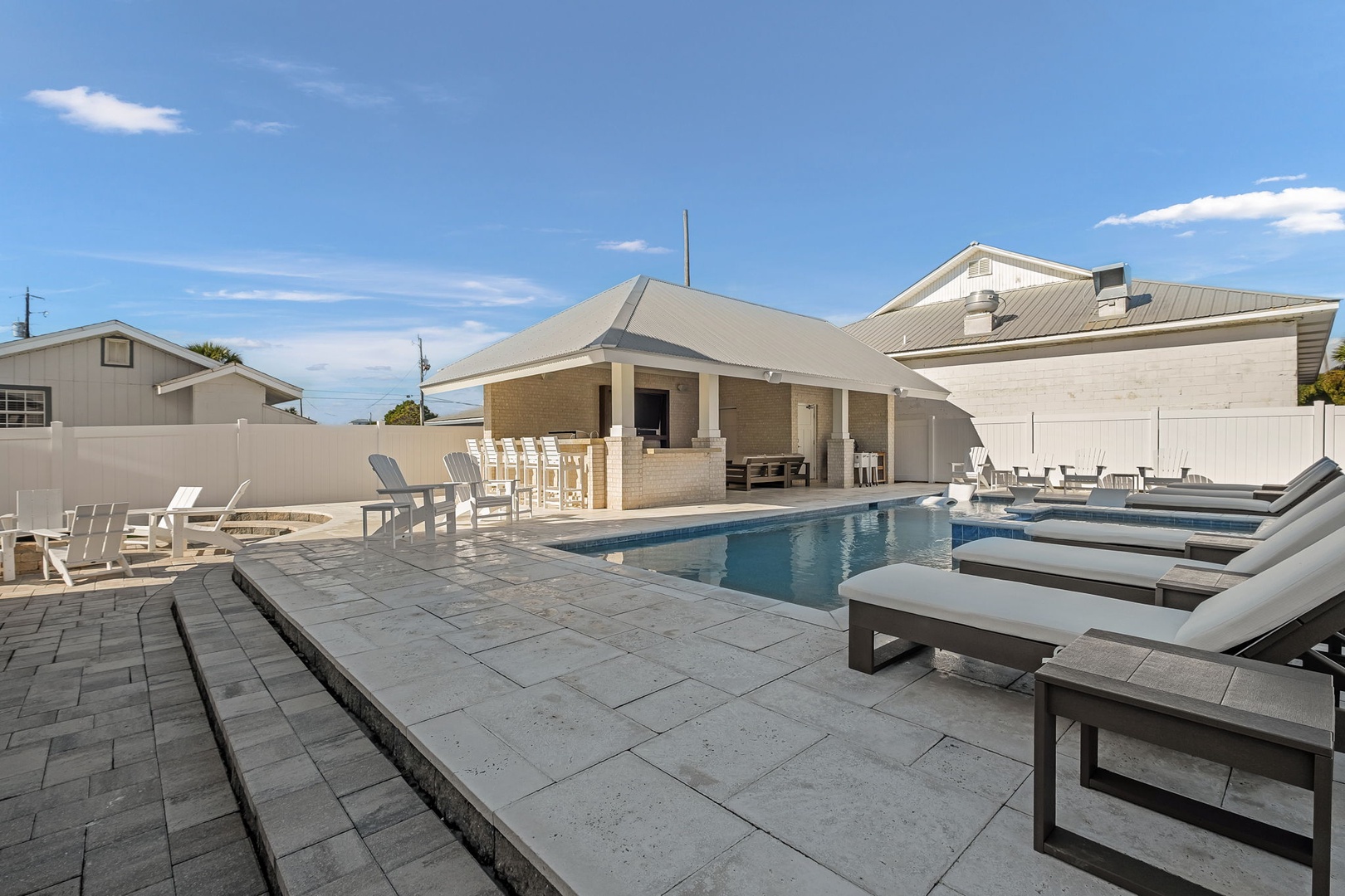 Dive into luxury with your private pool oasis, complete with plush lounge chairs and covered dining pavilion for perfect poolside relaxation.