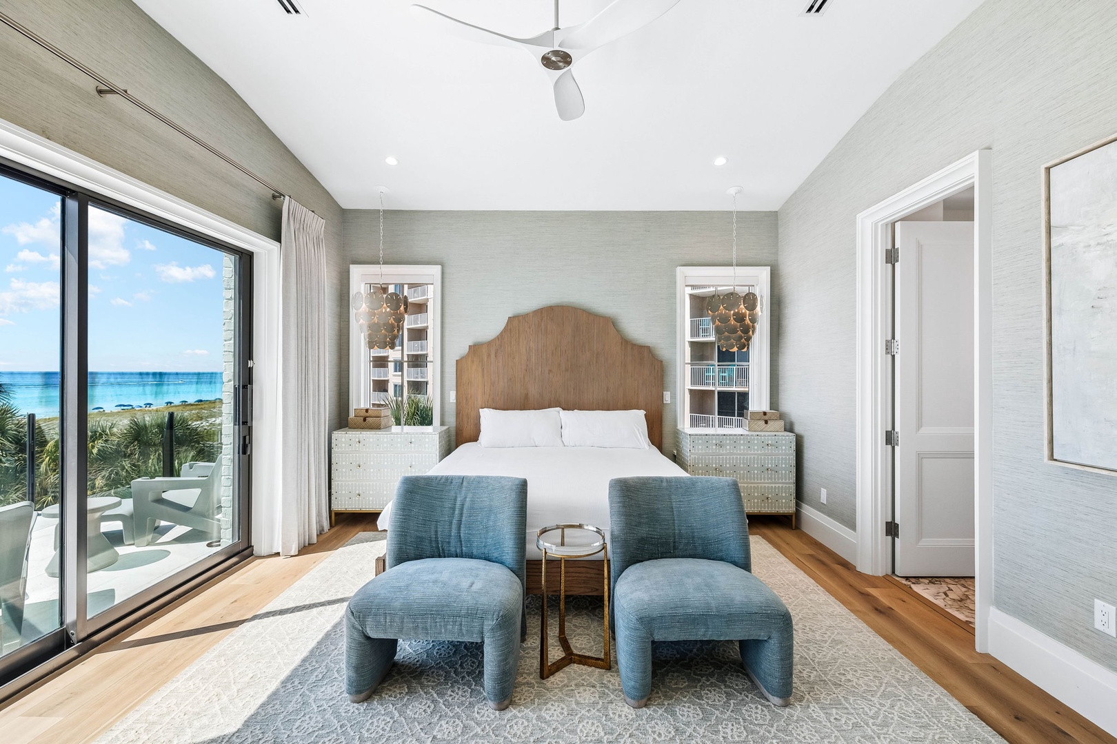 Wake up to stunning ocean views through your expansive windows. Coastal charm meets modern comfort in this beautifully designed retreat, where soft linens and soothing tones invite you to unwind in style.