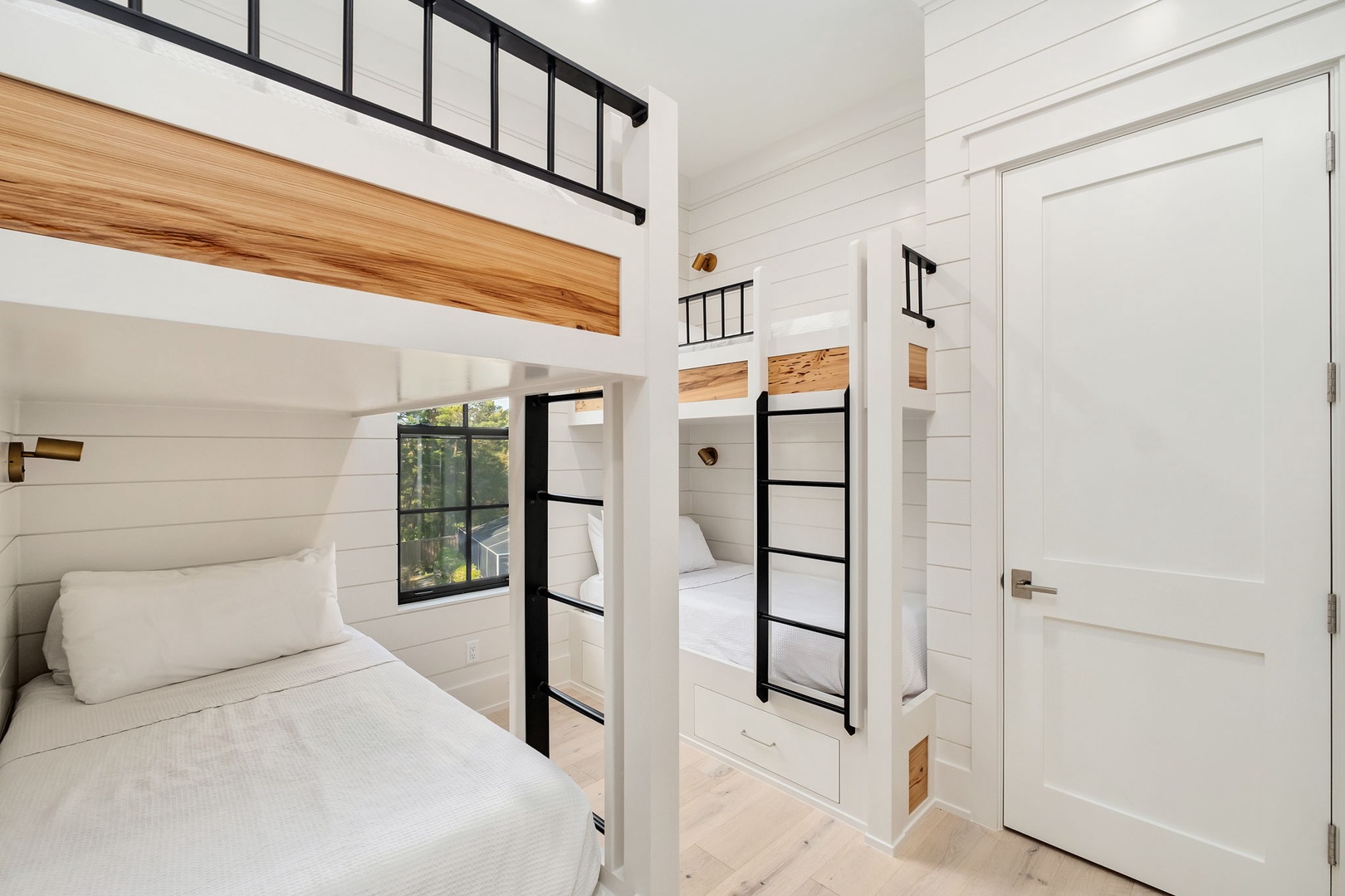 Cozy up in this beautifully crafted bunk room where you'll find peaceful sleep and modern comfort.