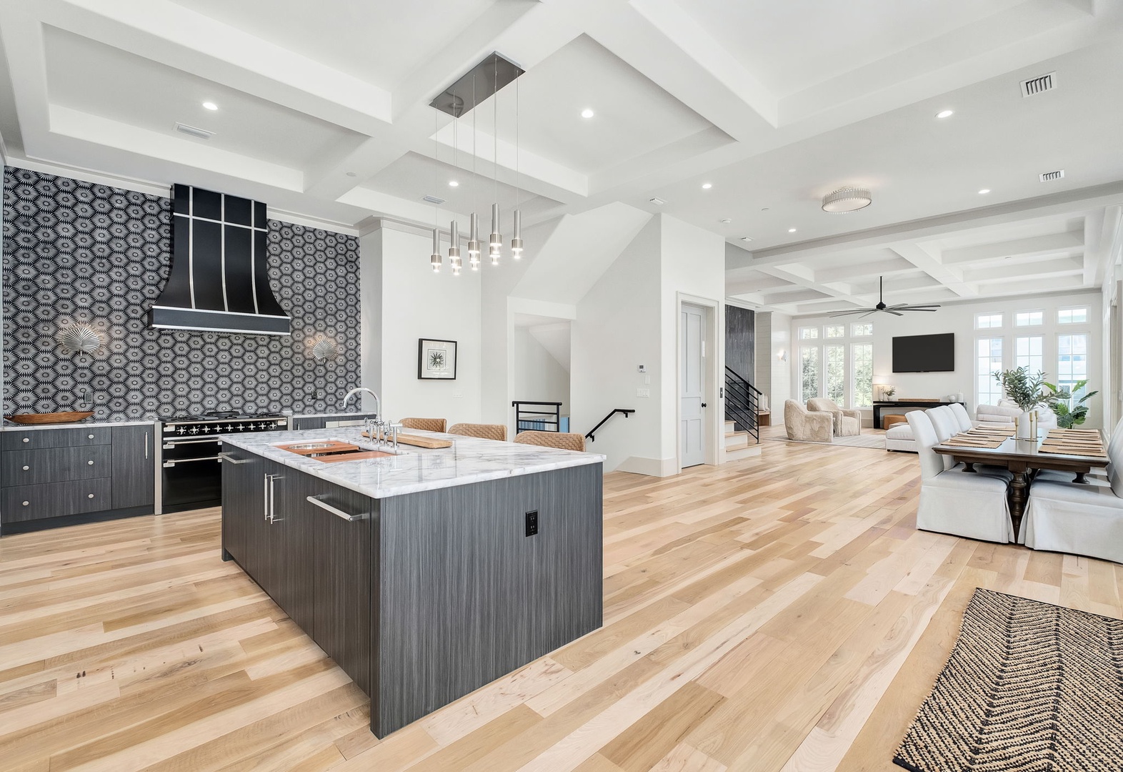 Stunning open-concept kitchen with marble island flows into your bright living space, creating the perfect gathering spot.