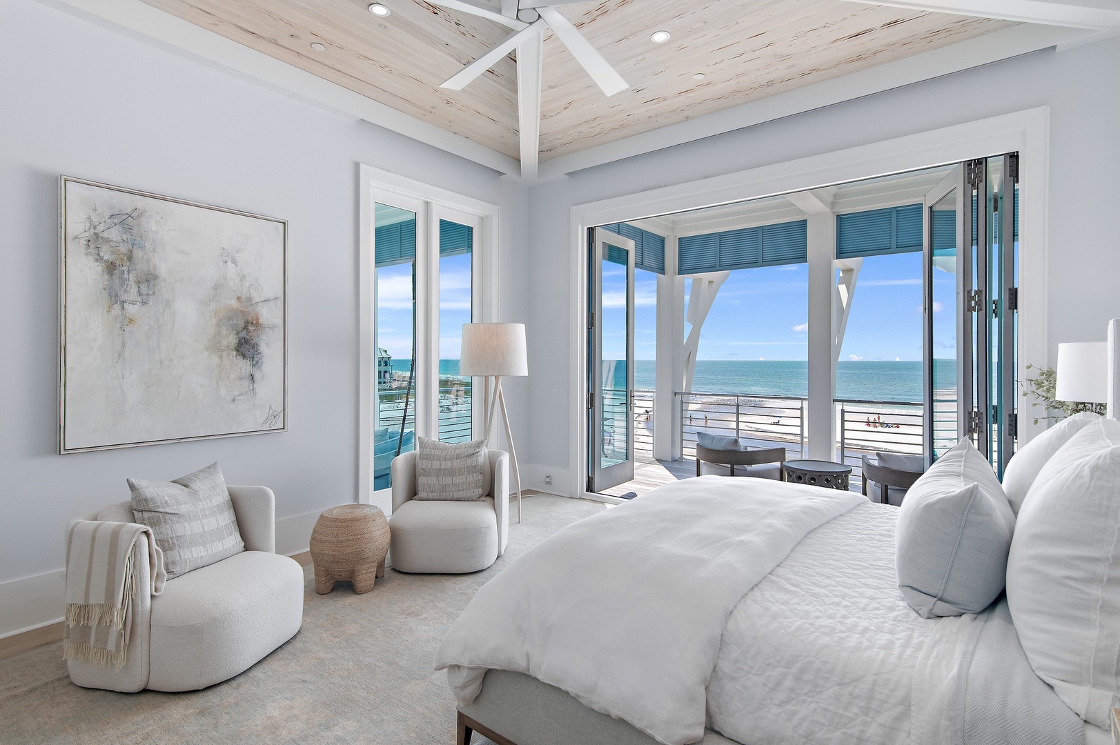 Wake up to breathtaking ocean views through your private balcony doors. Sink into plush white linens as natural light fills this serene coastal retreat, where every morning feels like a dream.