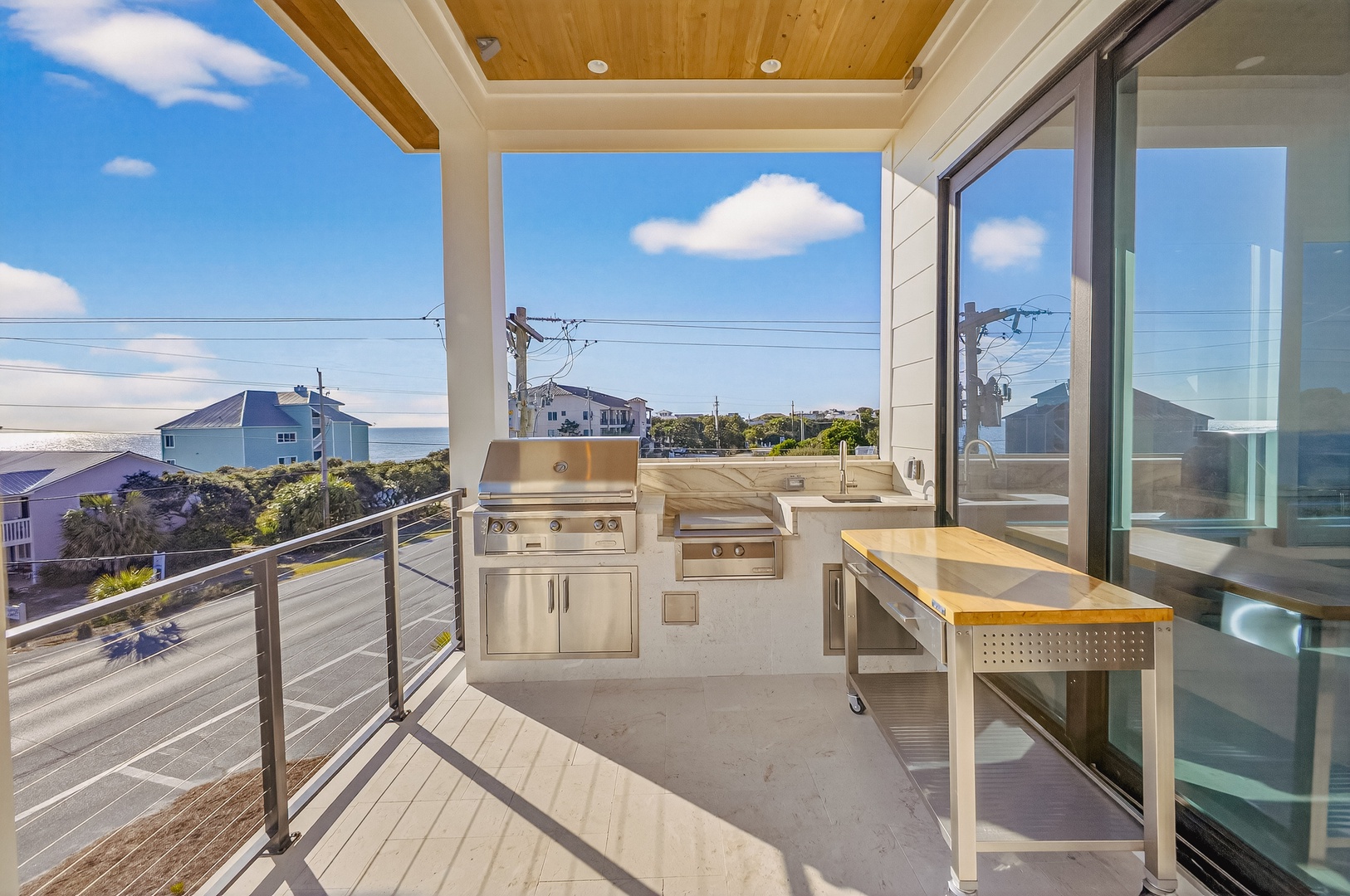 Grill your favorite meals on this covered terrace while enjoying stunning ocean views and the coastal breeze.