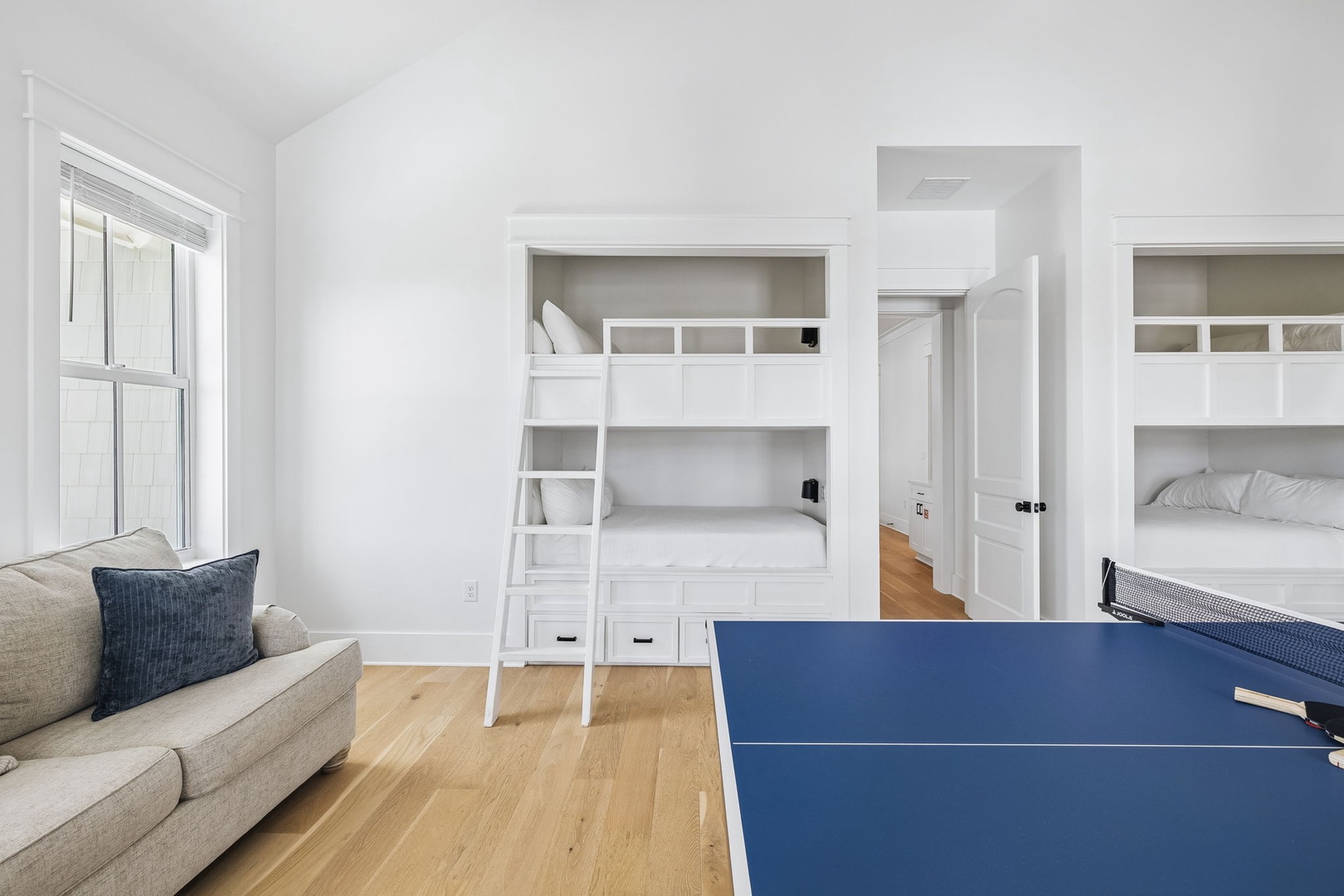 Challenge your crew to a game of ping pong in this bright, versatile space with built-in bunks and cozy seating for downtime between matches.