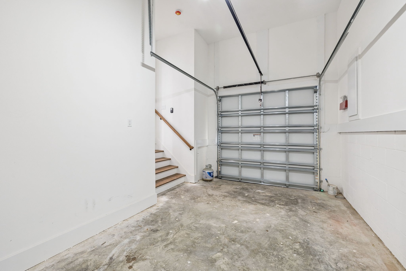 Your private garage offers secure parking and storage space with direct access to your rental home via the staircase.