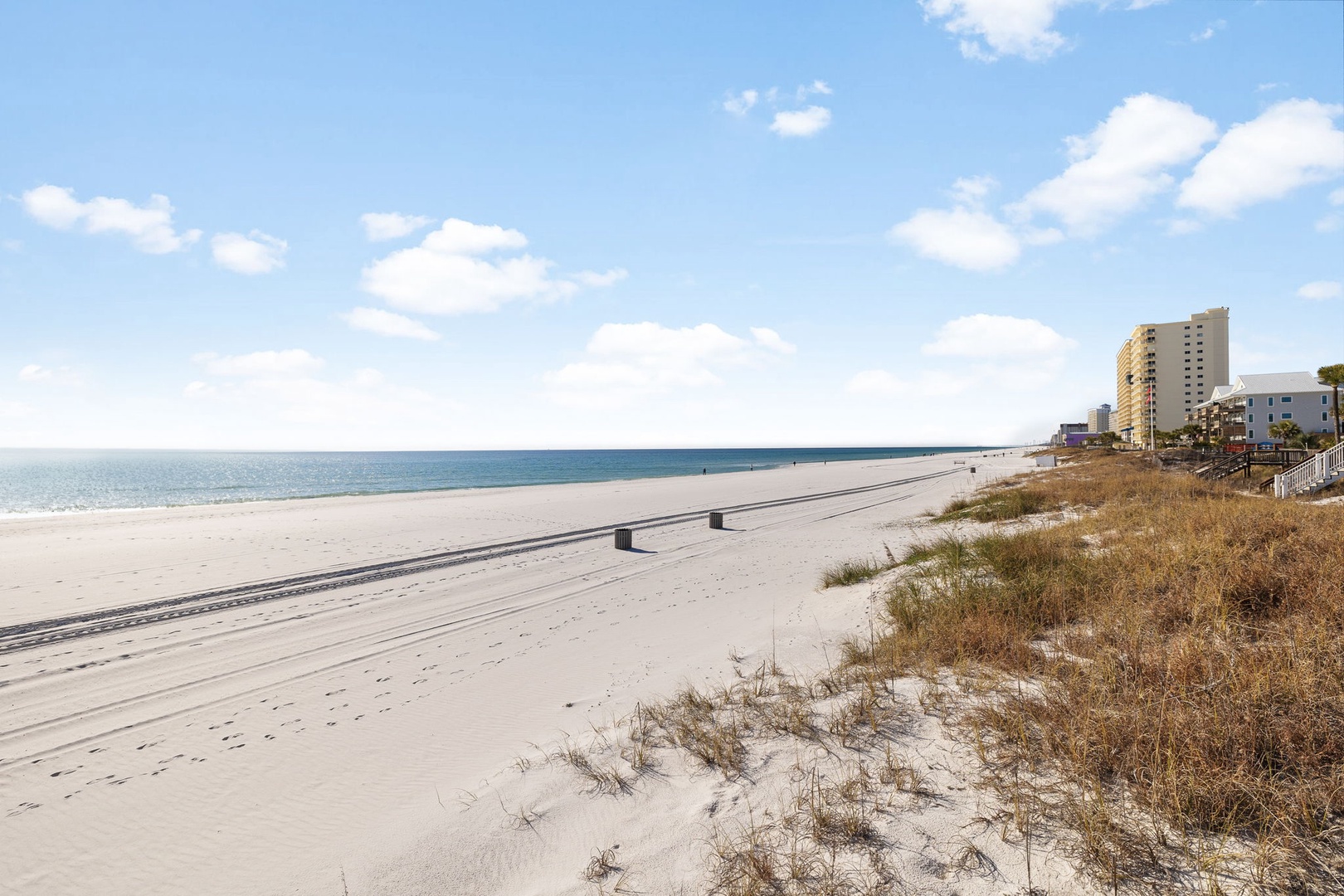Pristine beachfront stretches along the Gulf Coast with luxury condominiums and resort hotels dotting the shoreline.