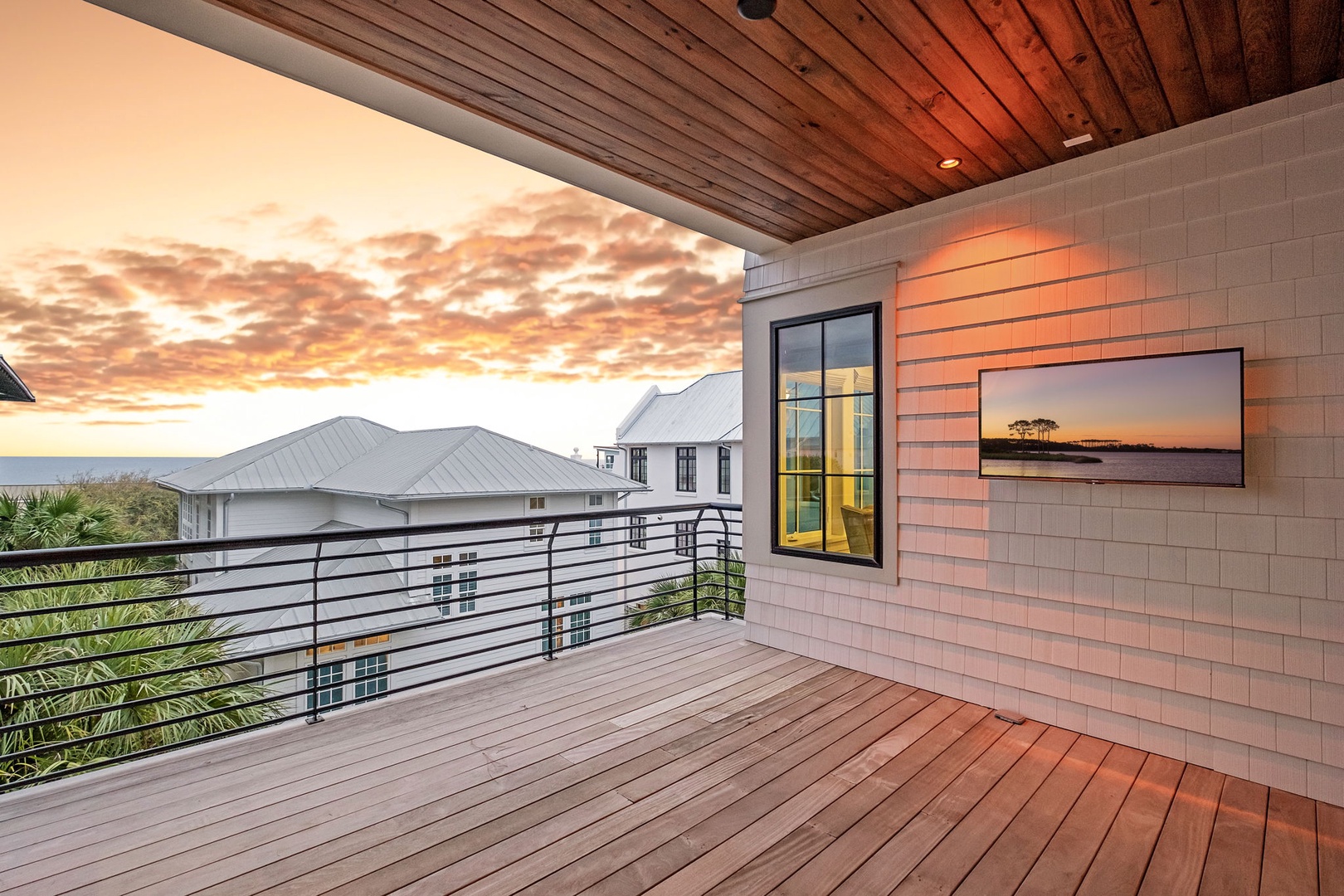 Unwind on your private deck as golden sunsets paint the sky, with modern comforts and peaceful views surrounding you.
