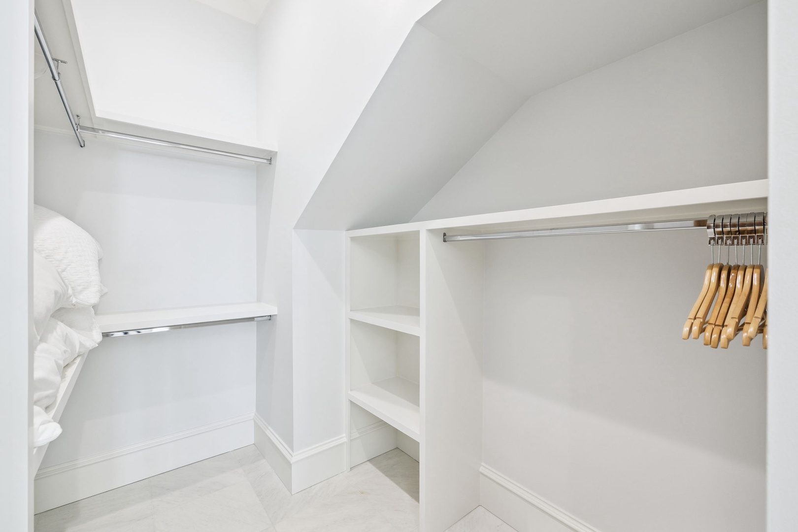 Your spacious walk-in closet offers abundant storage with multiple hanging rods and shelves for all your vacation wardrobe needs.
