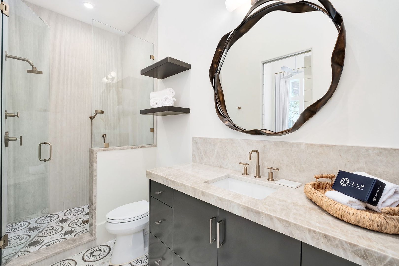 Step into your private sanctuary with gleaming marble counters, a spacious walk-in shower, and stylish details that make every moment feel luxurious.