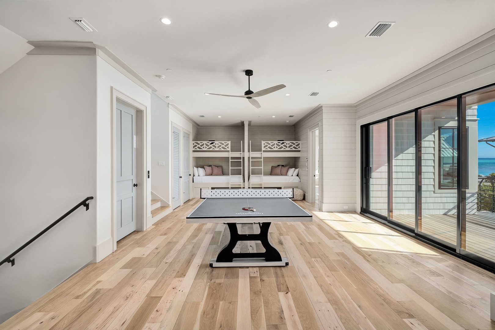 Challenge your group to friendly ping pong matches in this bright game room, complete with built-in bunk beds for post-game relaxation.