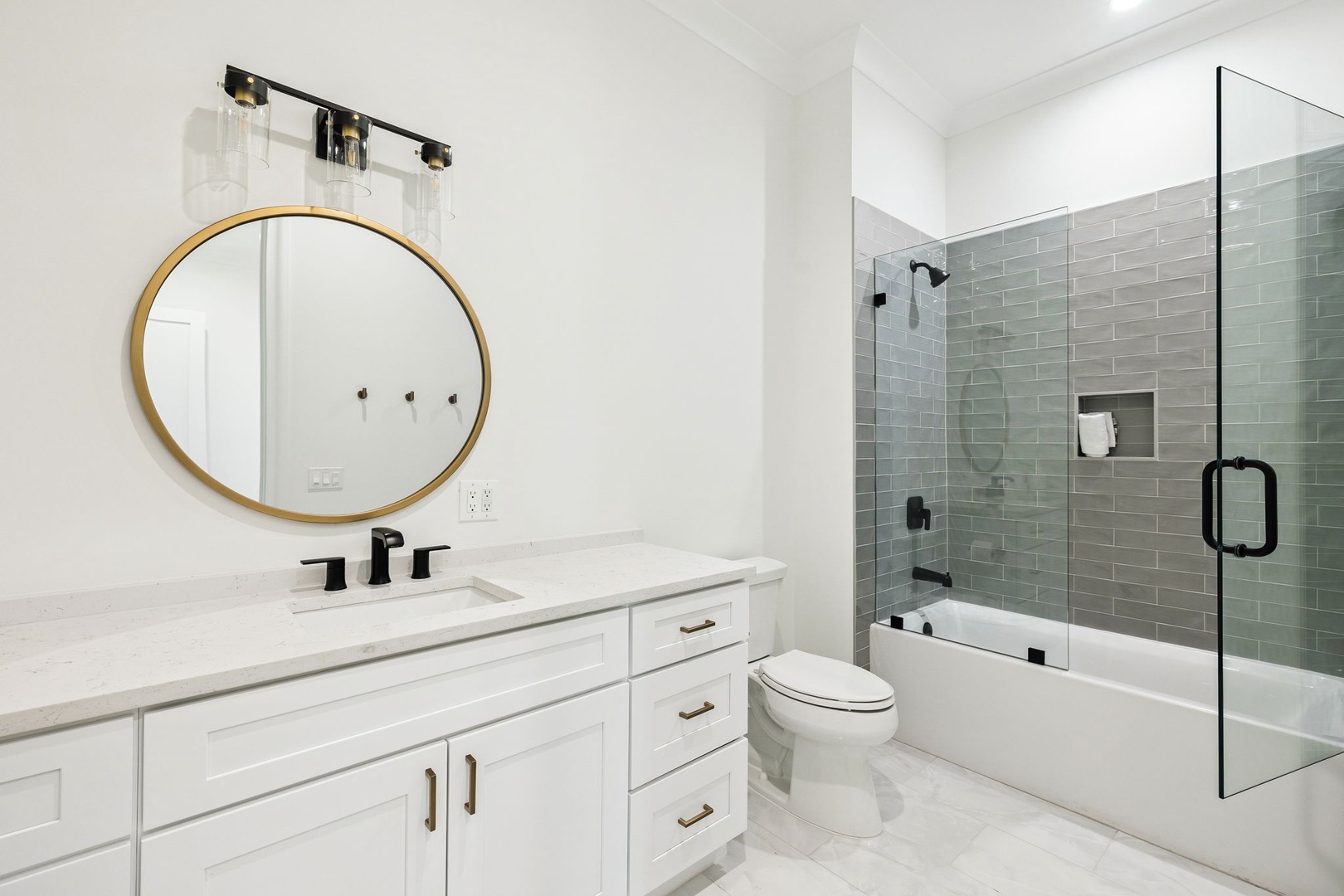 Step into your spa-like bathroom featuring elegant subway tiles, gleaming fixtures, and a luxurious tub-shower combo for ultimate relaxation.