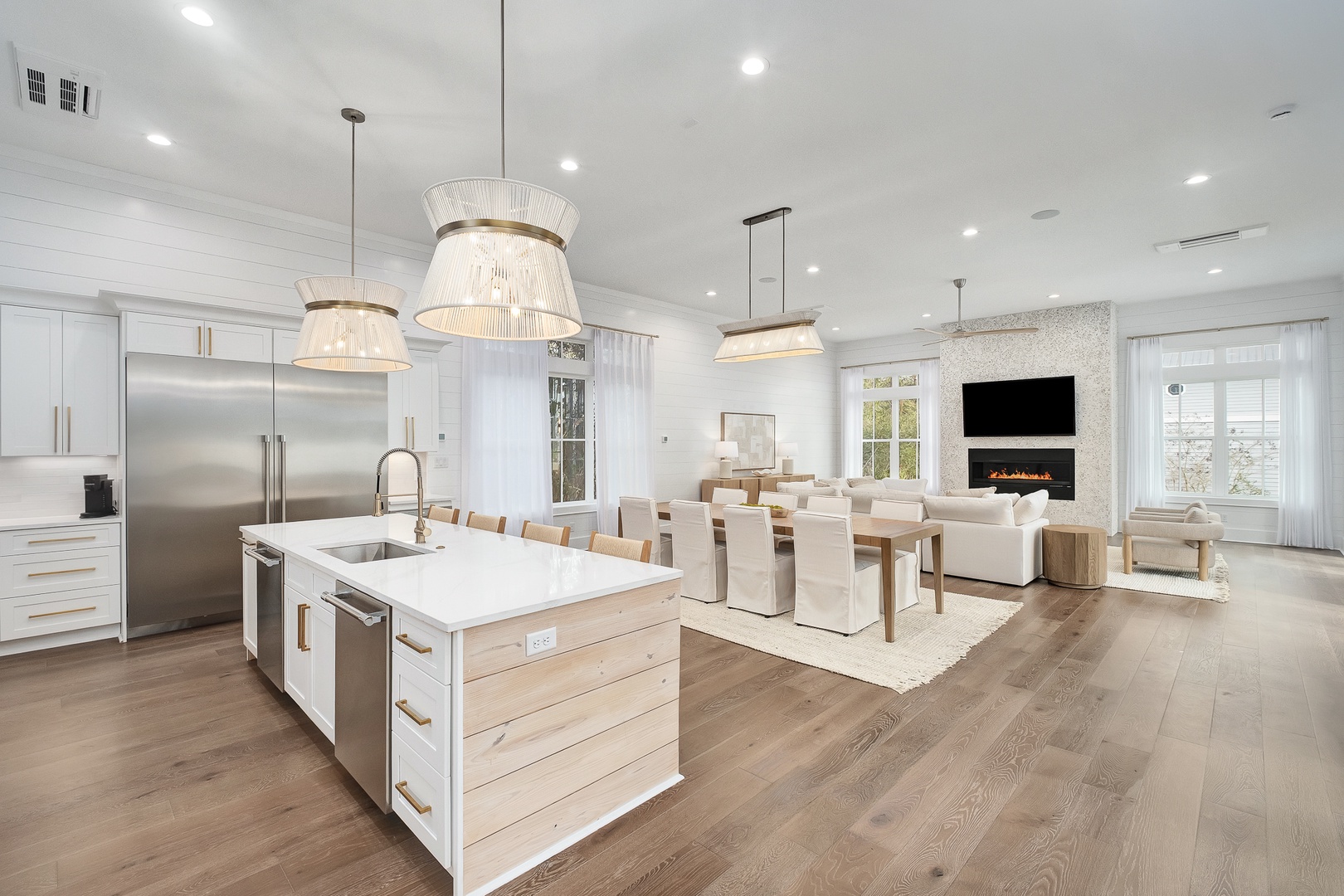 Step into this stunning open-concept space where your gourmet kitchen flows seamlessly into elegant dining and cozy living areas.