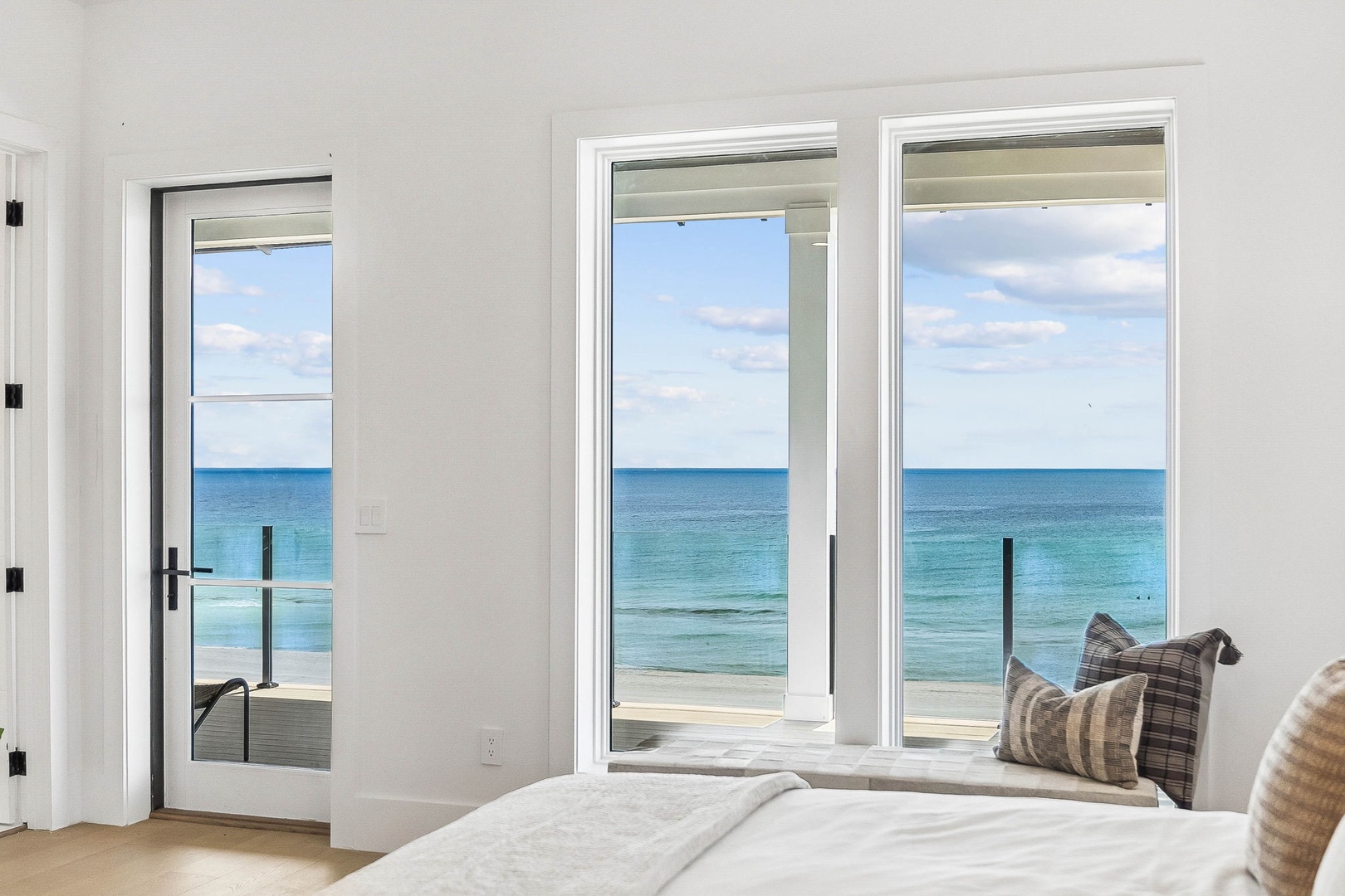 Wake up to endless turquoise waters right from your bed. Step through the glass doors and feel the ocean breeze—your private beachfront sanctuary awaits.