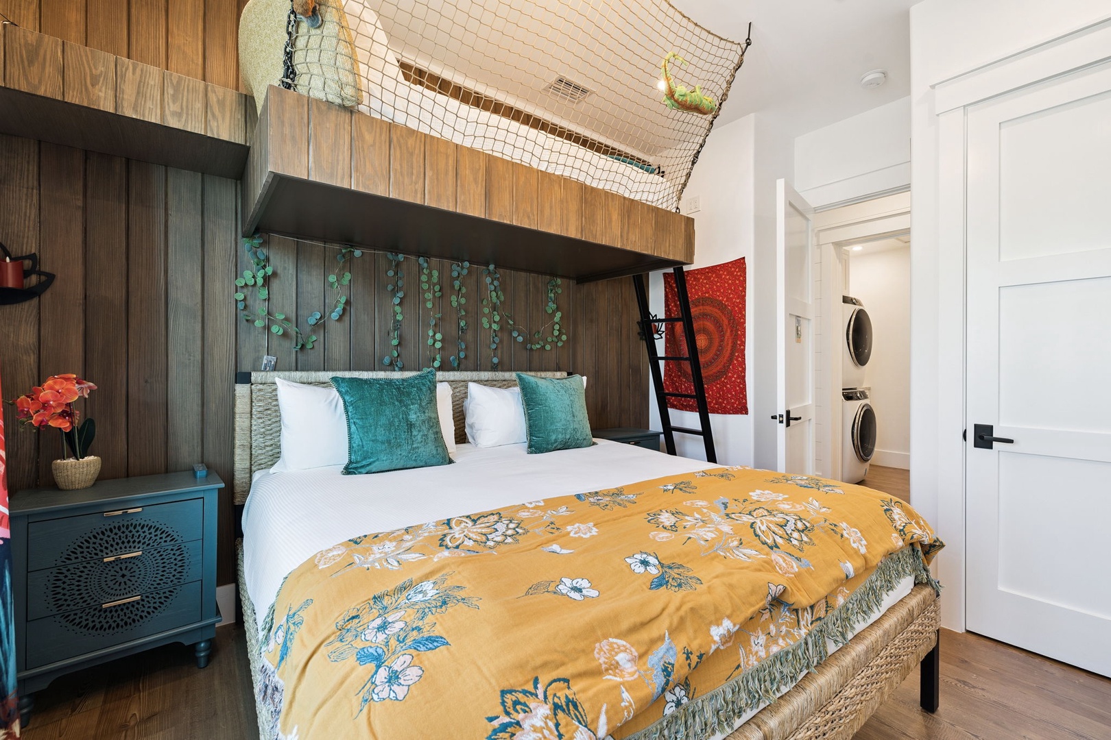 Sleep soundly in your cozy bunk-style bedroom, featuring vibrant linens and natural wood touches that create a warm, bohemian sanctuary.