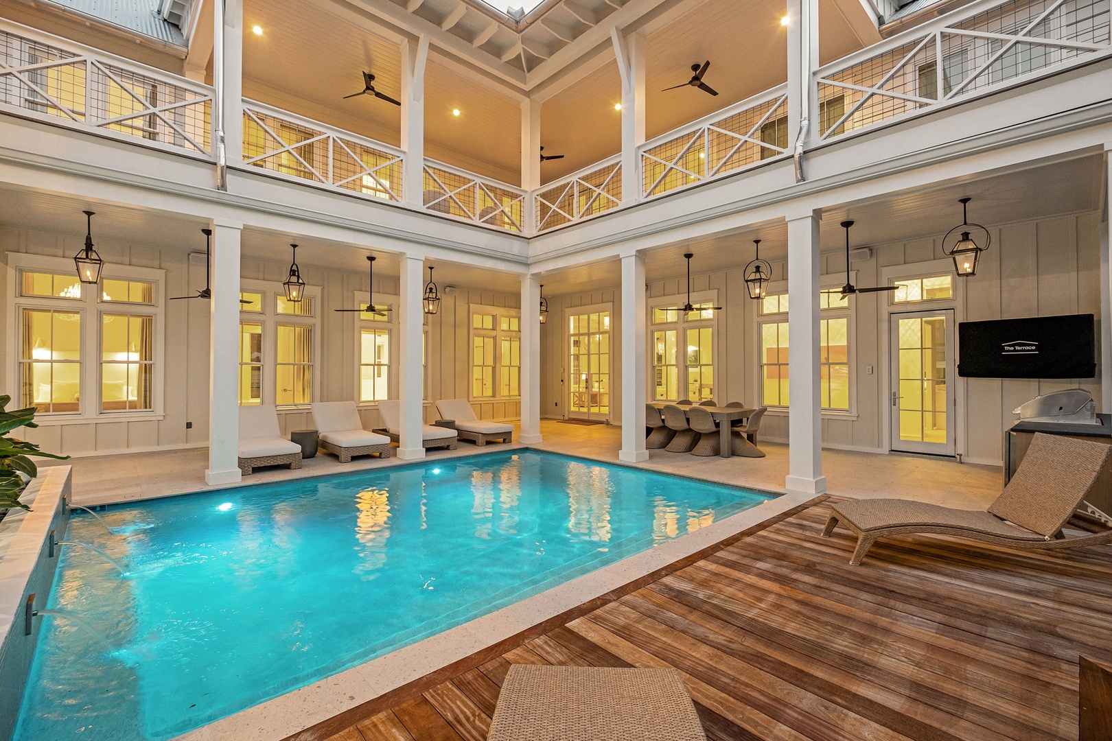 Relax beside your private indoor pool, where elegant columns frame the space and soft lighting reflects off the water. Lounge on the deck or gaze up at the soaring ceiling—a tranquil escape within your own home.