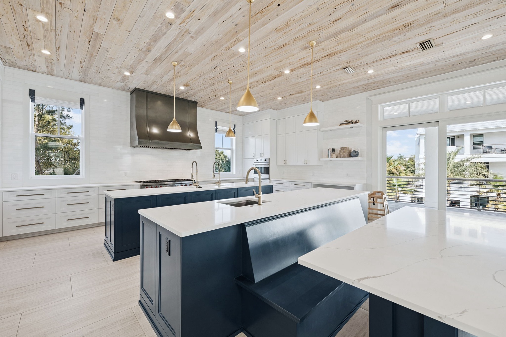 Your chef-worthy kitchen awaits with sleek countertops, premium appliances, and stunning wood ceiling that creates the perfect culinary sanctuary.