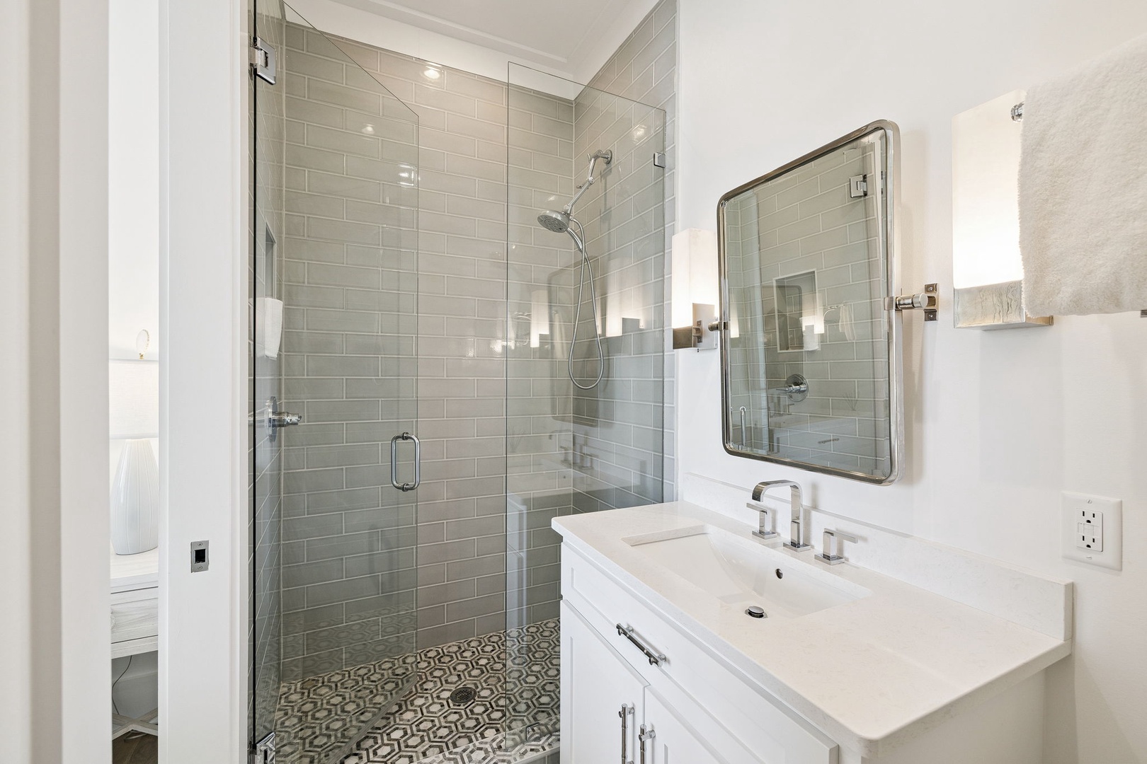 Step into your elegant ensuite with stunning subway tile shower and stylish vanity—perfect for refreshing morning routines.