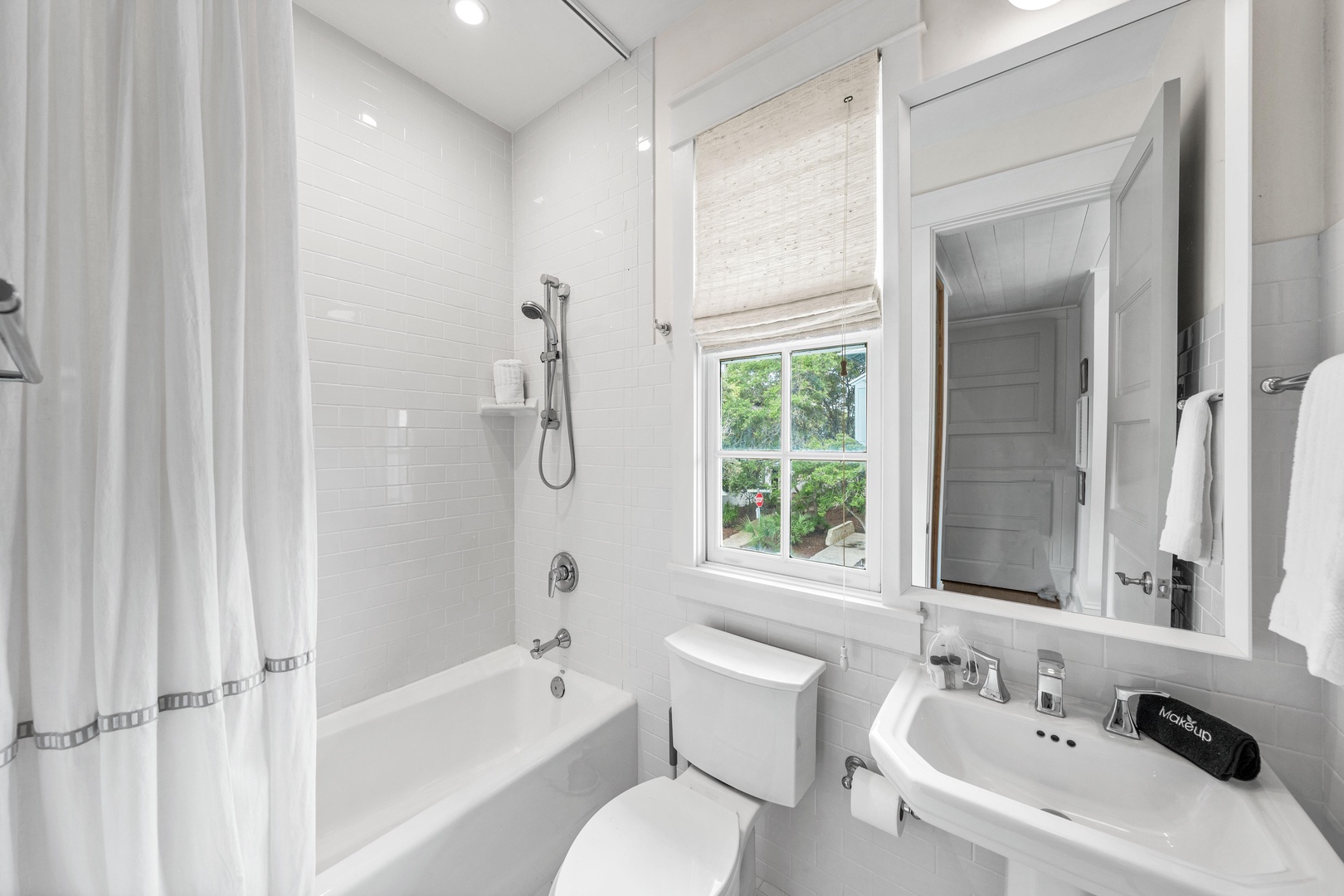 Step into your pristine bathroom with a relaxing soaking tub, refreshing shower, and bright natural light from the garden window.