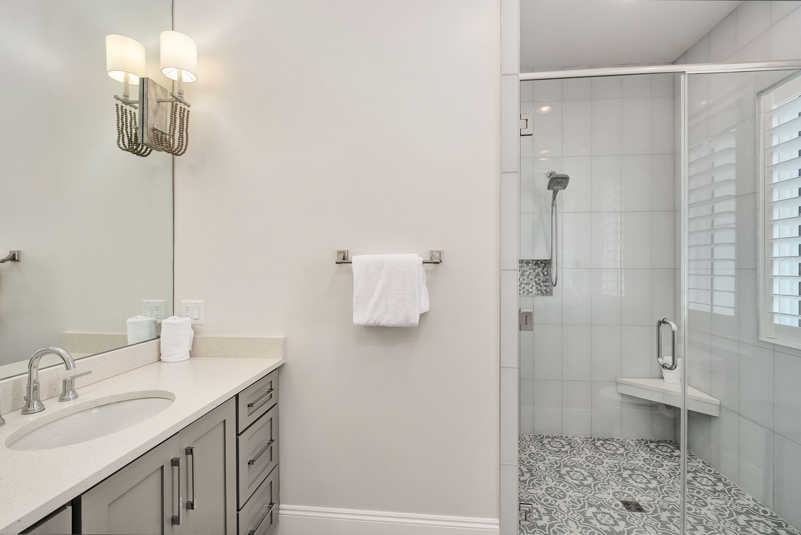Step into your spa-like bathroom retreat with elegant marble counters, a spacious glass shower, and luxurious finishes that make every morning feel indulgent.