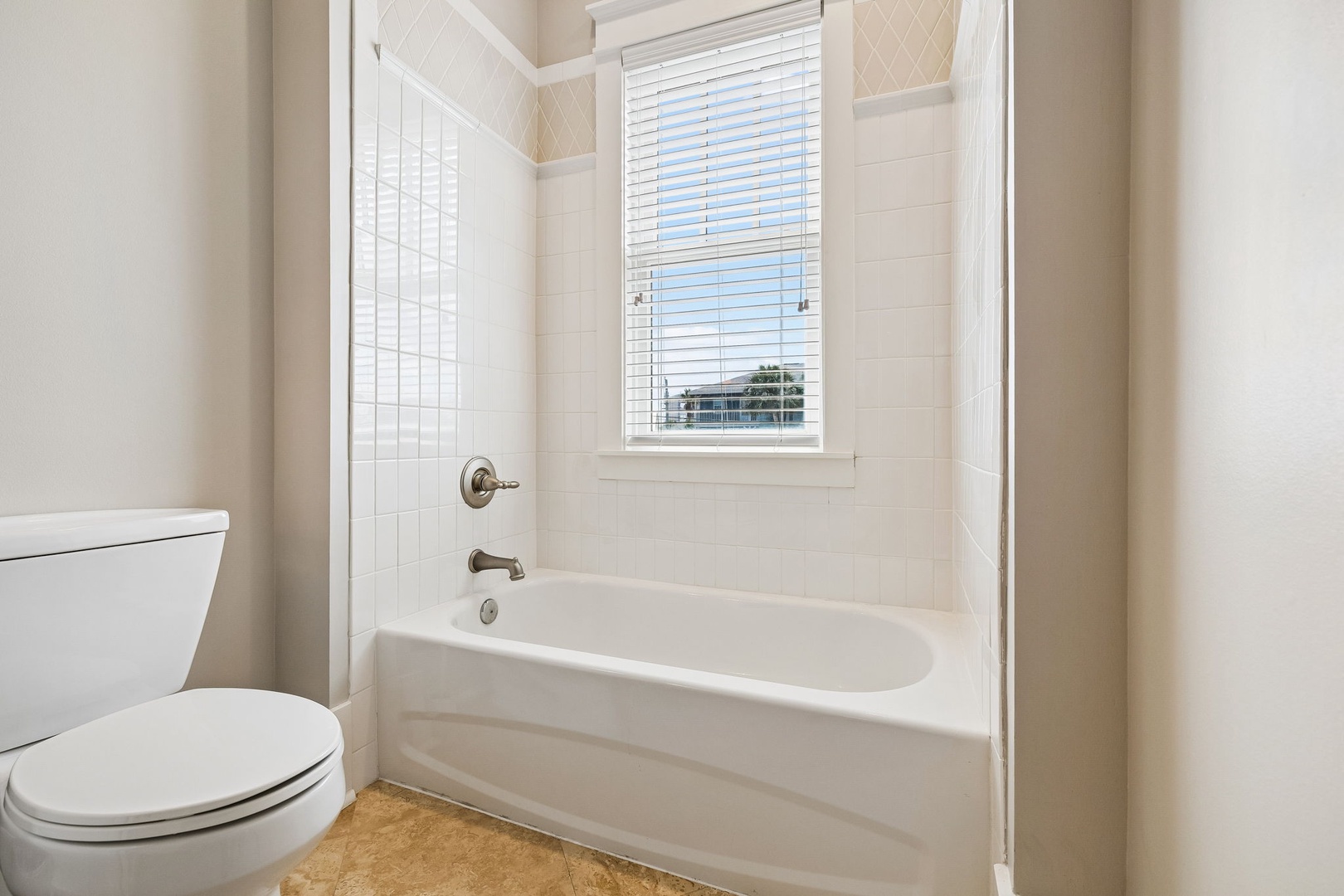 Your private bathroom offers a clean, bright retreat with a soaking tub perfect for unwinding after a day of adventure.