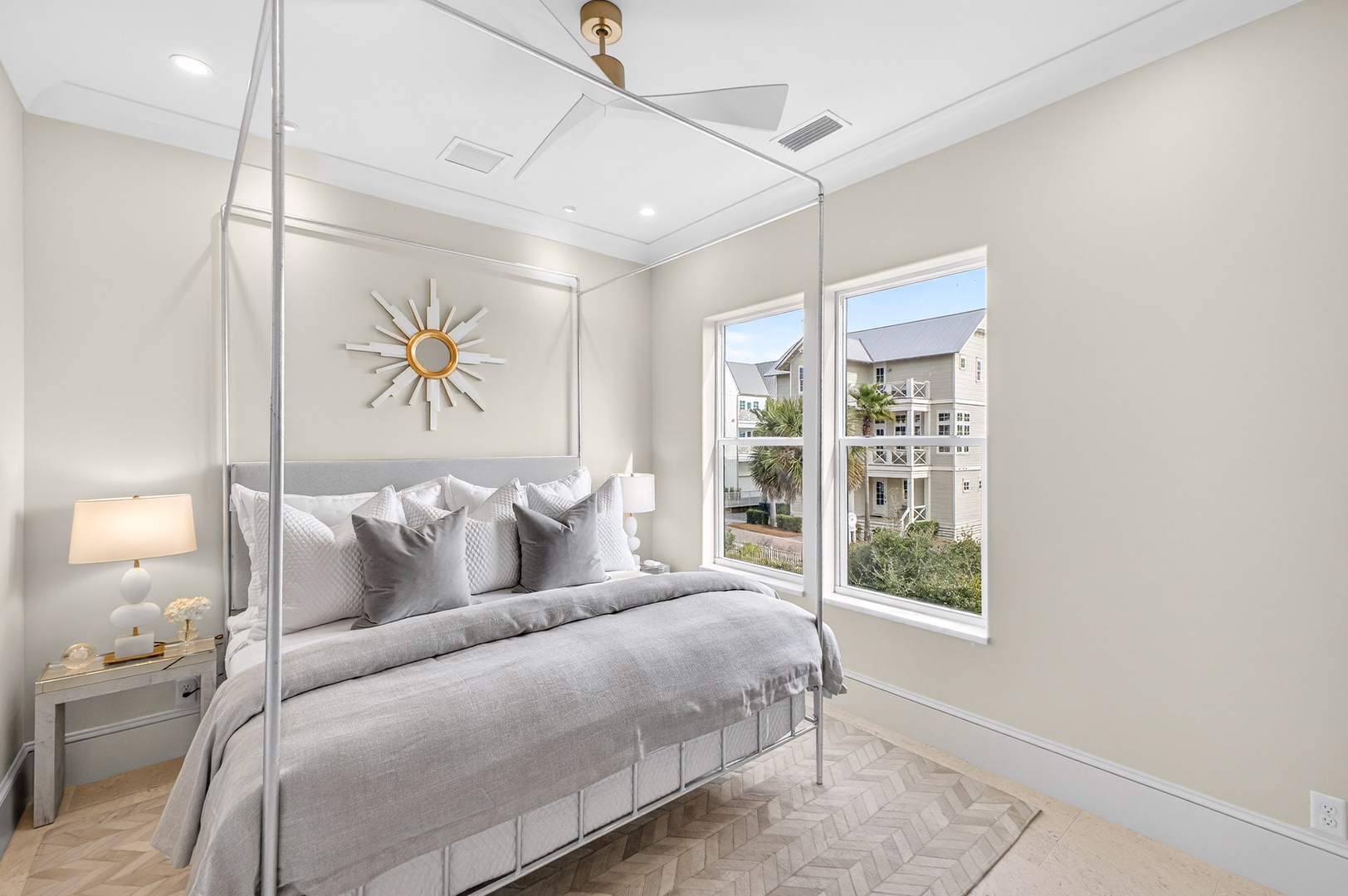 Sink into the plush four-poster bed and wake to peaceful neighborhood views through your private windows.
