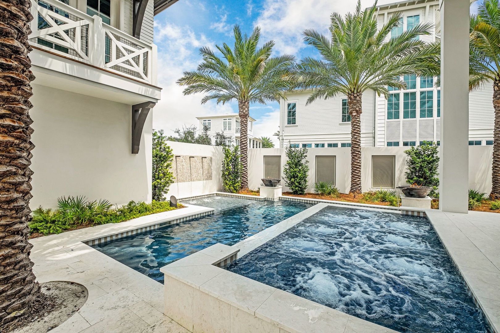 Your private oasis awaits: soak in the bubbling hot tub, take a refreshing dip in the pool, and relax under swaying palms in this intimate courtyard retreat.