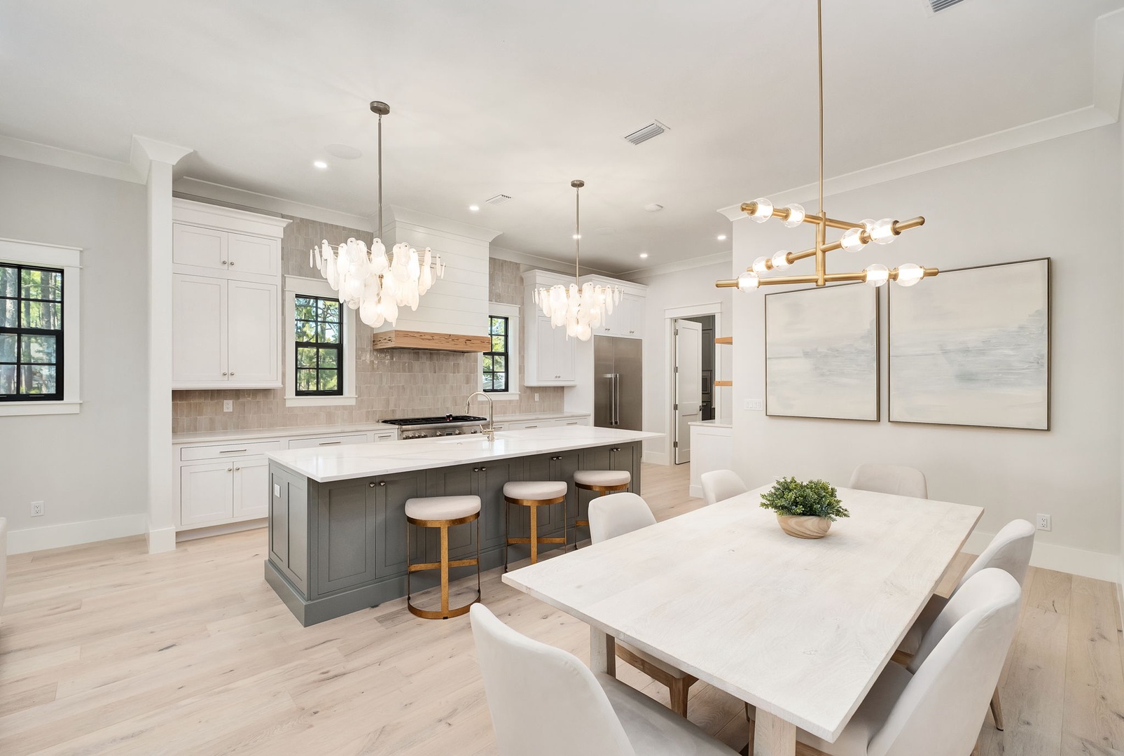 Step into your elegant open-concept space where culinary dreams come alive. This stunning kitchen flows seamlessly into your dining area, perfect for memorable meals.