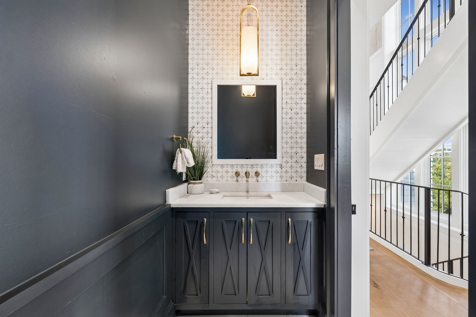 Refresh in your elegantly appointed bathroom with a marble vanity, designer fixtures, and a chic tile backsplash that brings a spa-like feel to your daily routine.