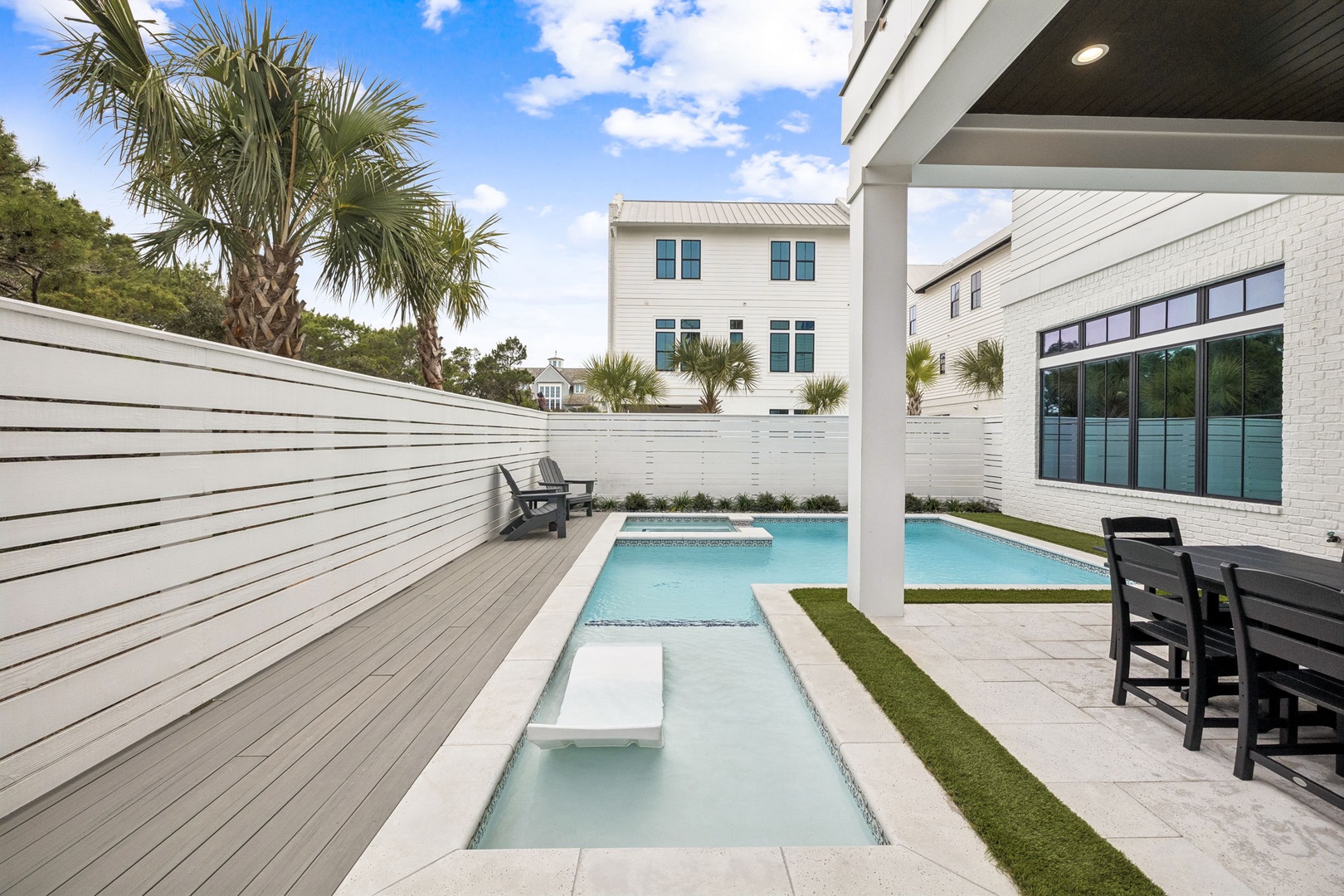 Your private oasis awaits with a stunning pool and spa where you can soak up the sun on modern decking.