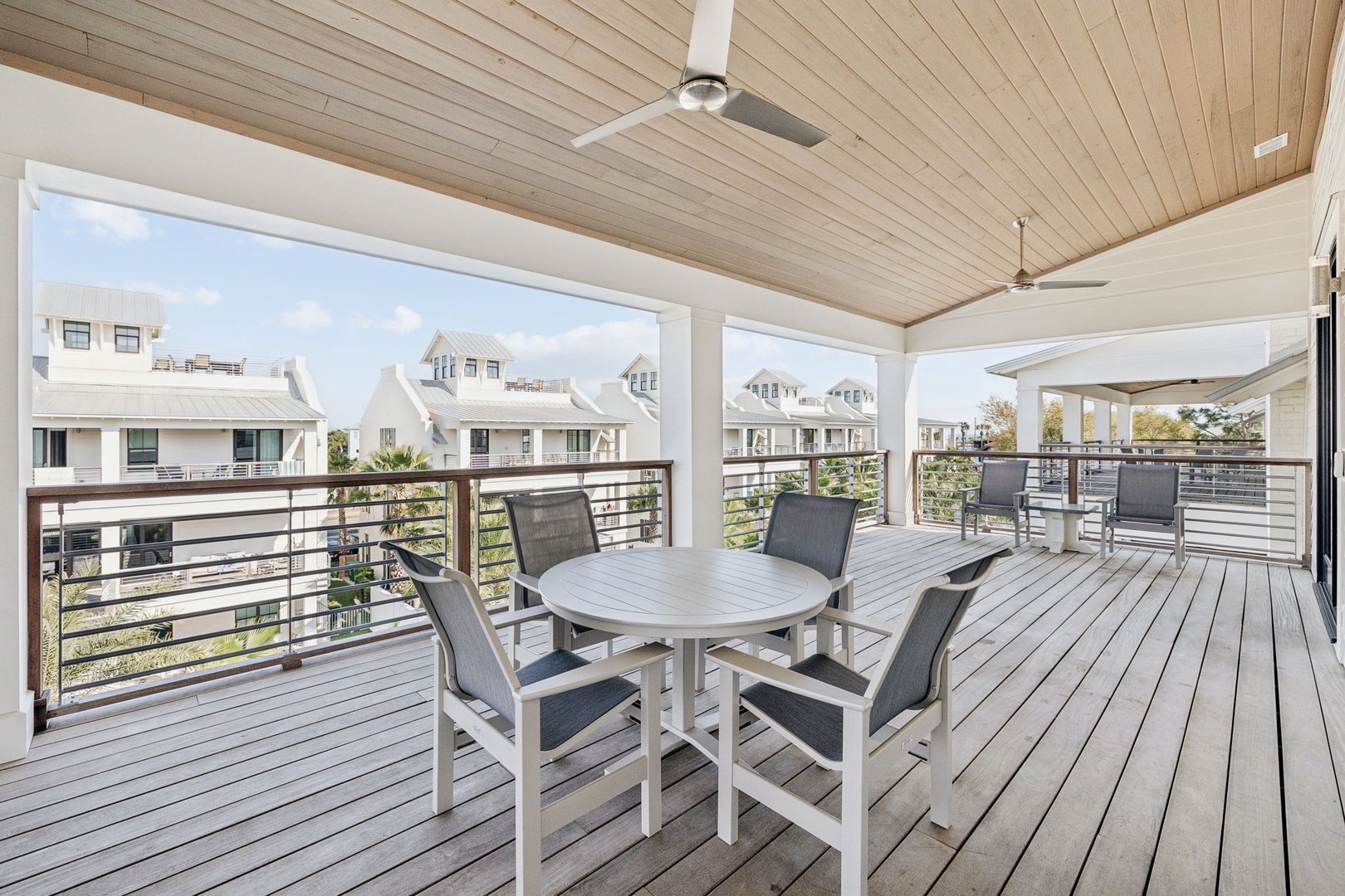 Dine al fresco on your spacious covered balcony with stylish seating and refreshing ceiling fans overhead.