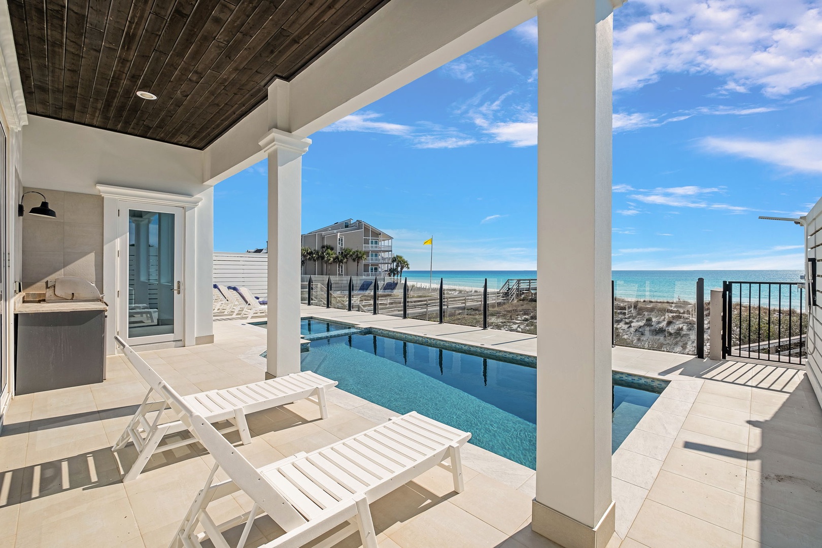 Your private poolside paradise awaits with stunning ocean views and luxurious loungers for ultimate relaxation.