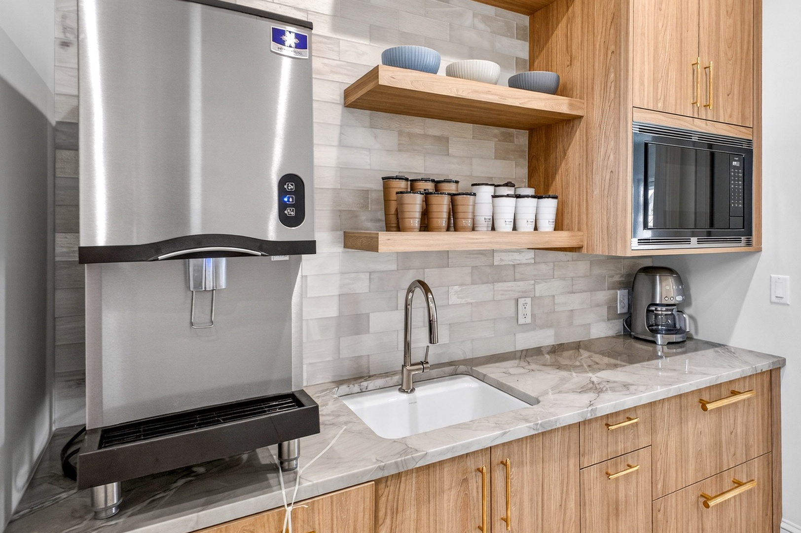 Your modern kitchen gleams with marble countertops and premium appliances, ready for your culinary adventures.