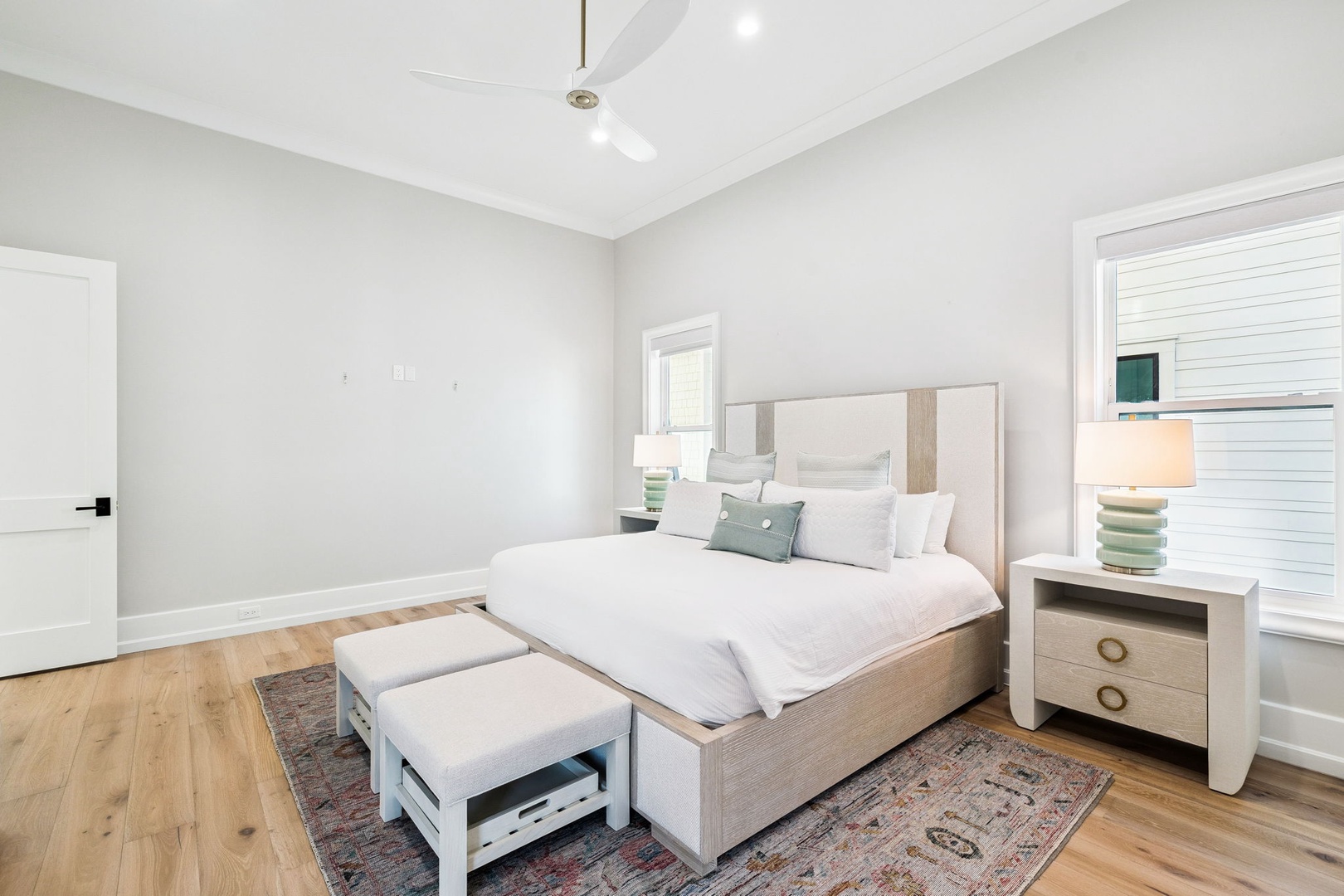 Rest peacefully in this serene bedroom with soft linens, calming coastal colors, and gentle natural light filtering through your windows.