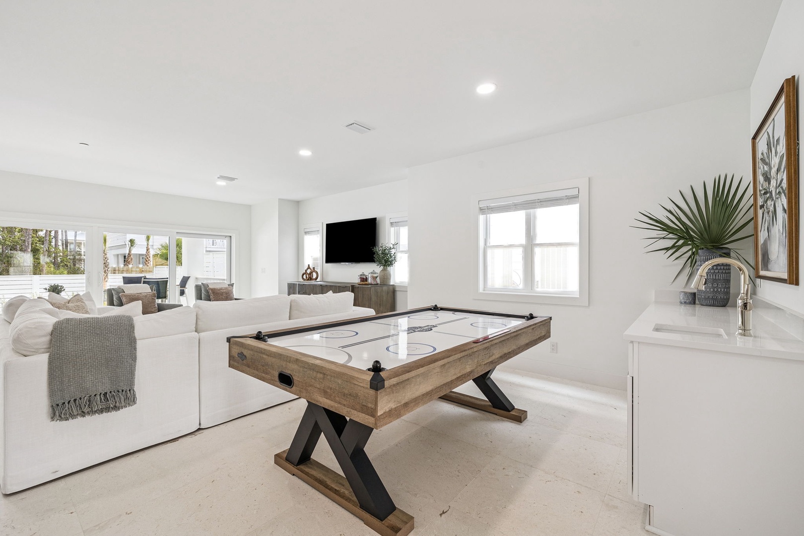 Your game room awaits with air hockey fun and comfortable seating for friendly competition and relaxation.