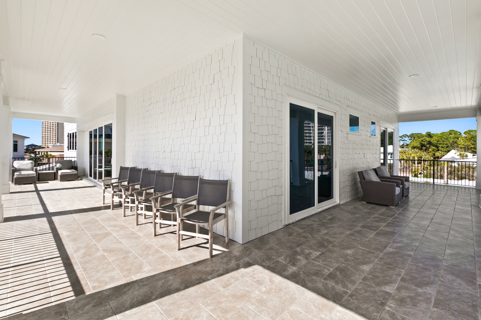 Step outside onto your private rooftop terrace, where sunny days and fresh breezes await. With cozy seating areas and tree-lined views, this bright outdoor retreat is your perfect escape for morning coffee or sunset relaxation.