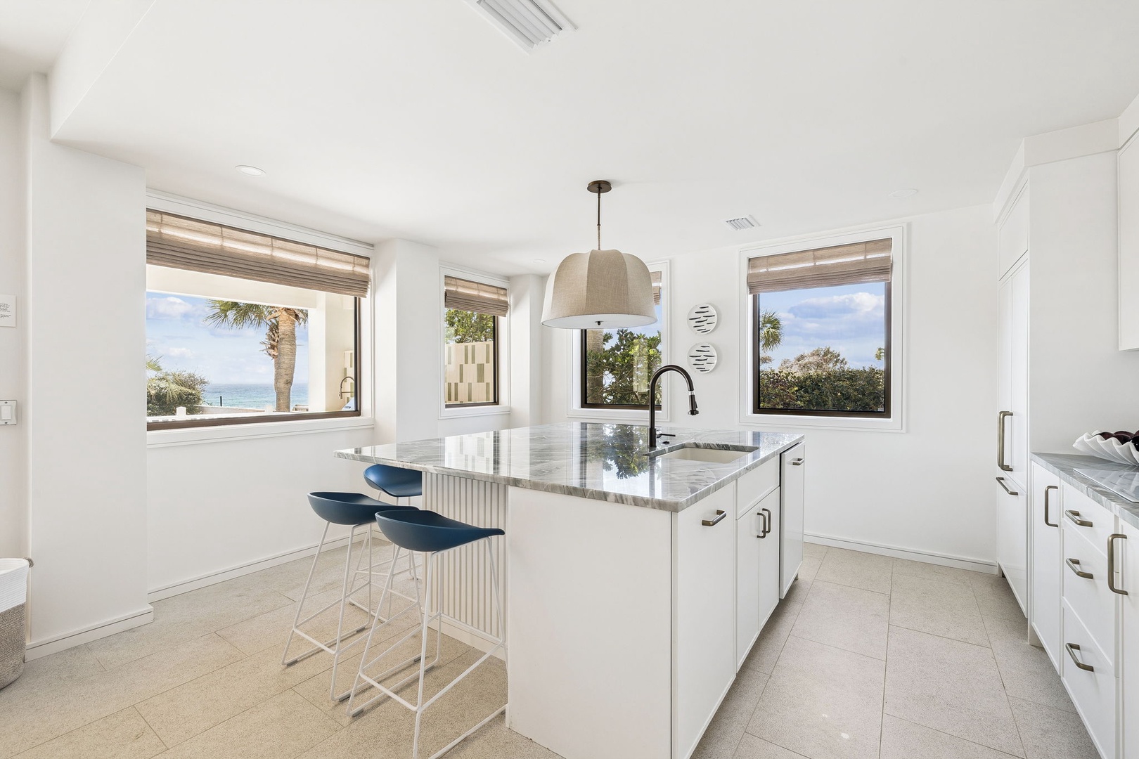 Cook with ocean breezes flowing through your bright, modern kitchen while palm trees sway just outside your windows.