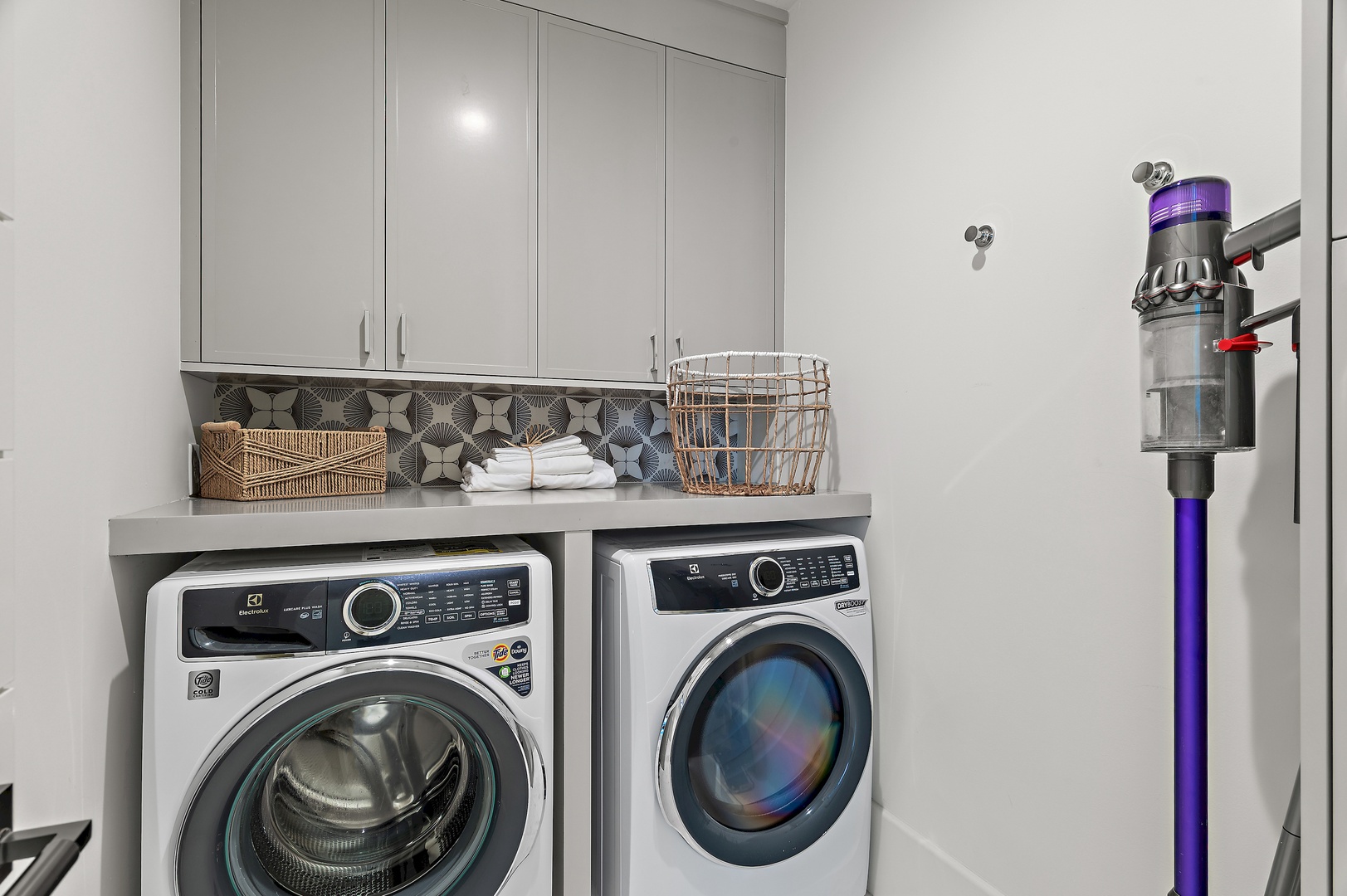 This dedicated laundry space features modern appliances and thoughtful organization to keep your vacation wardrobe fresh and tidy throughout your stay.