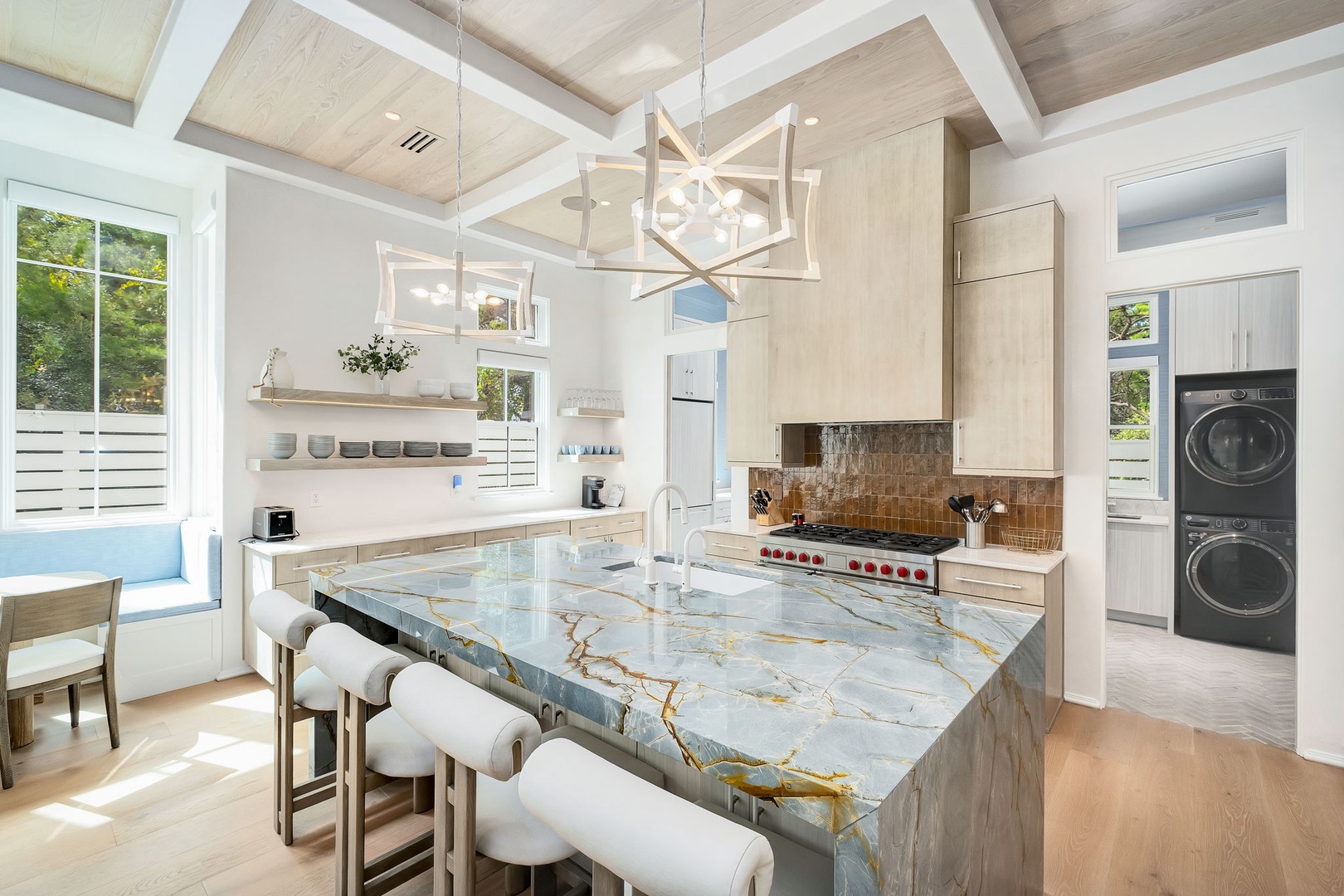 Step into your gourmet kitchen, where soaring wood-beam ceilings and brilliant natural light create an inspiring space for cooking and gathering together.