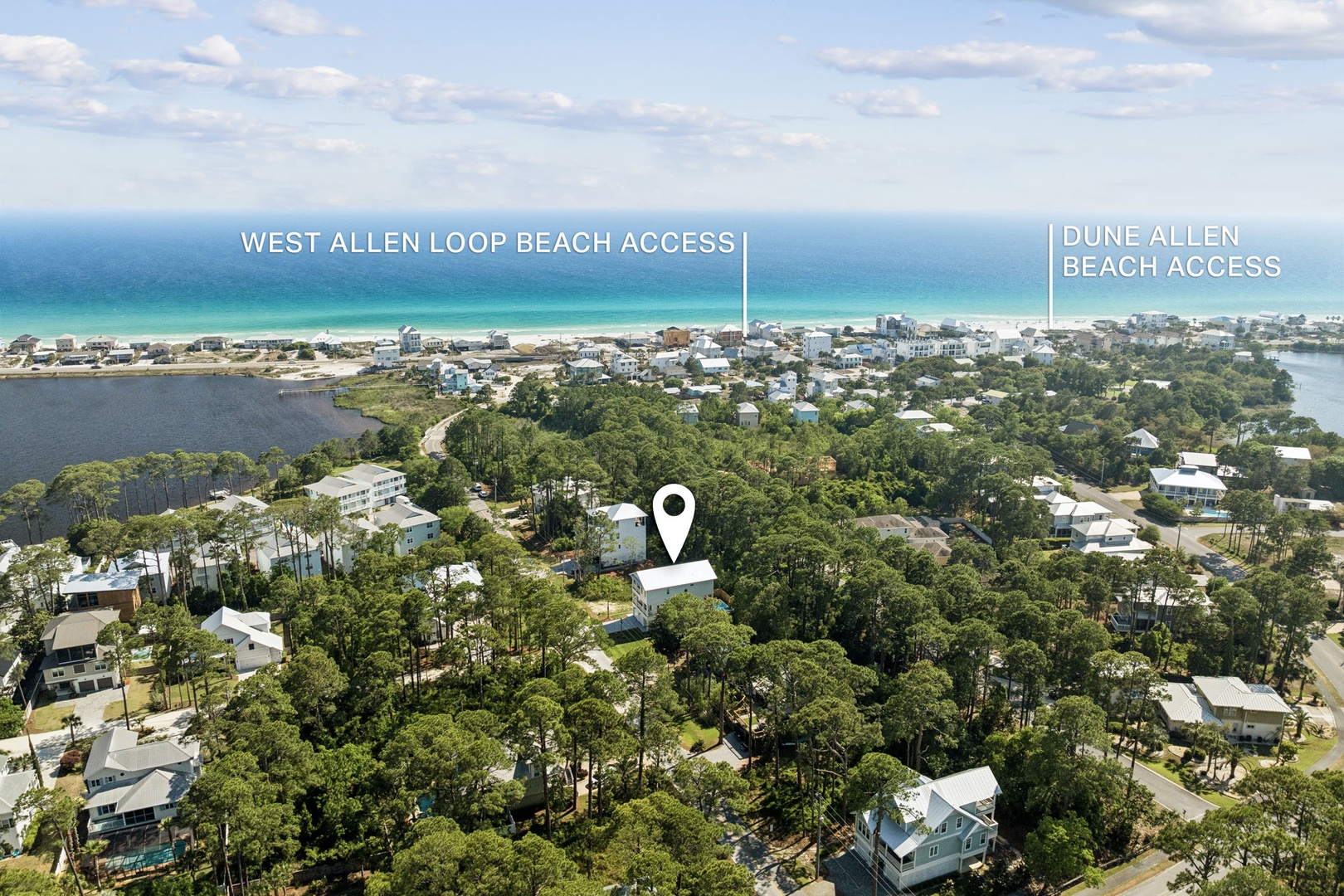 Aerial view showcasing the property's location nestled among coastal pines, with two nearby beach access points and the turquoise Gulf waters just a short walk away.