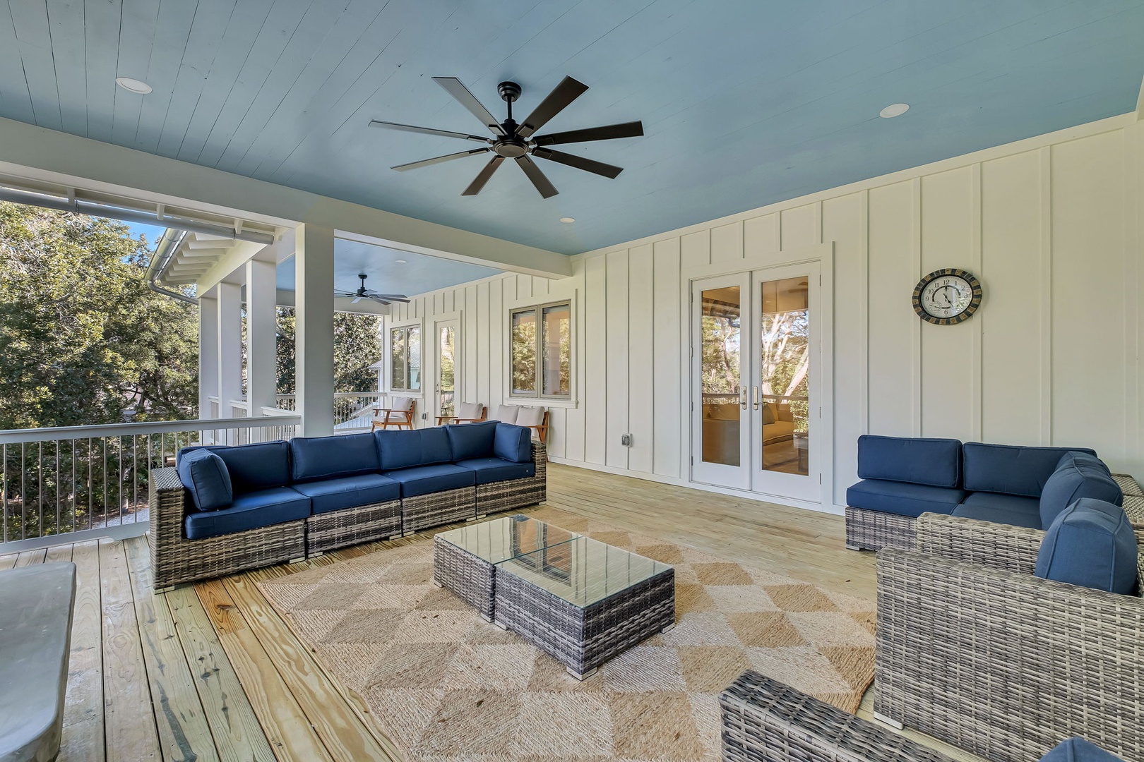 Unwind on your private covered deck with plush seating and ceiling fans—your perfect spot for morning coffee or evening relaxation.