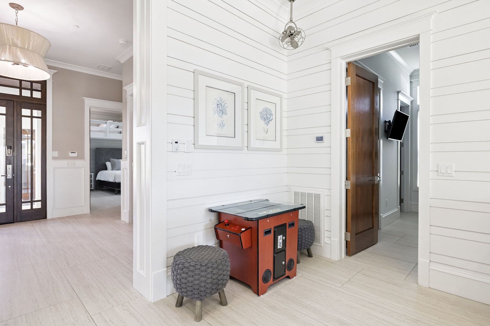 Your coastal retreat features crisp white shiplap walls and vintage-inspired accents that create a serene, sophisticated atmosphere for your getaway.