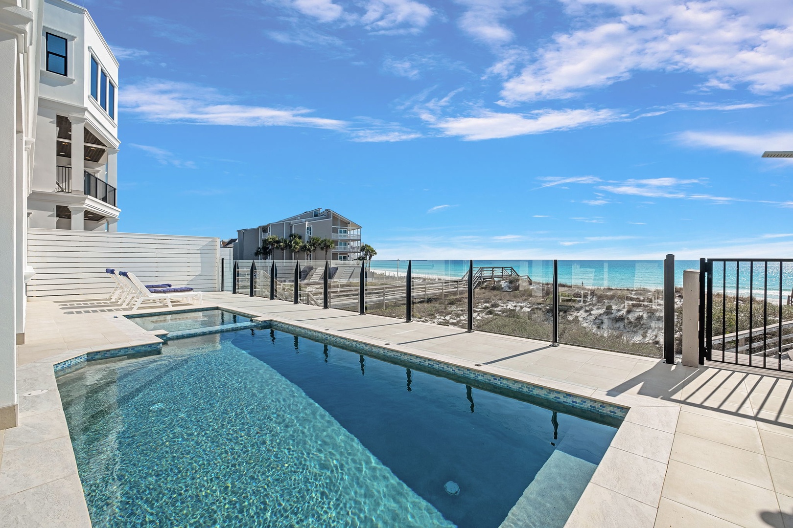 Your private pool overlooks pristine white sand beaches and turquoise waters. Lounge on the deck and soak in breathtaking coastal views.