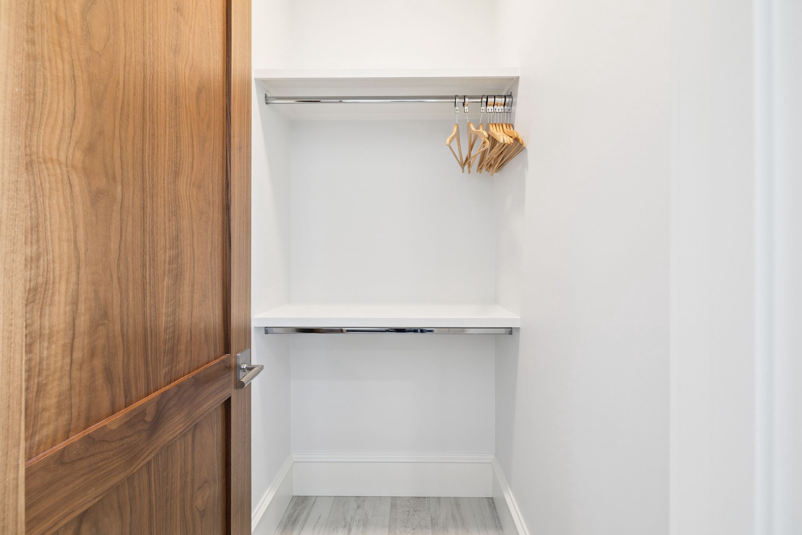 Your spacious walk-in closet offers dual hanging rods and ample space to organize your wardrobe during your stay.