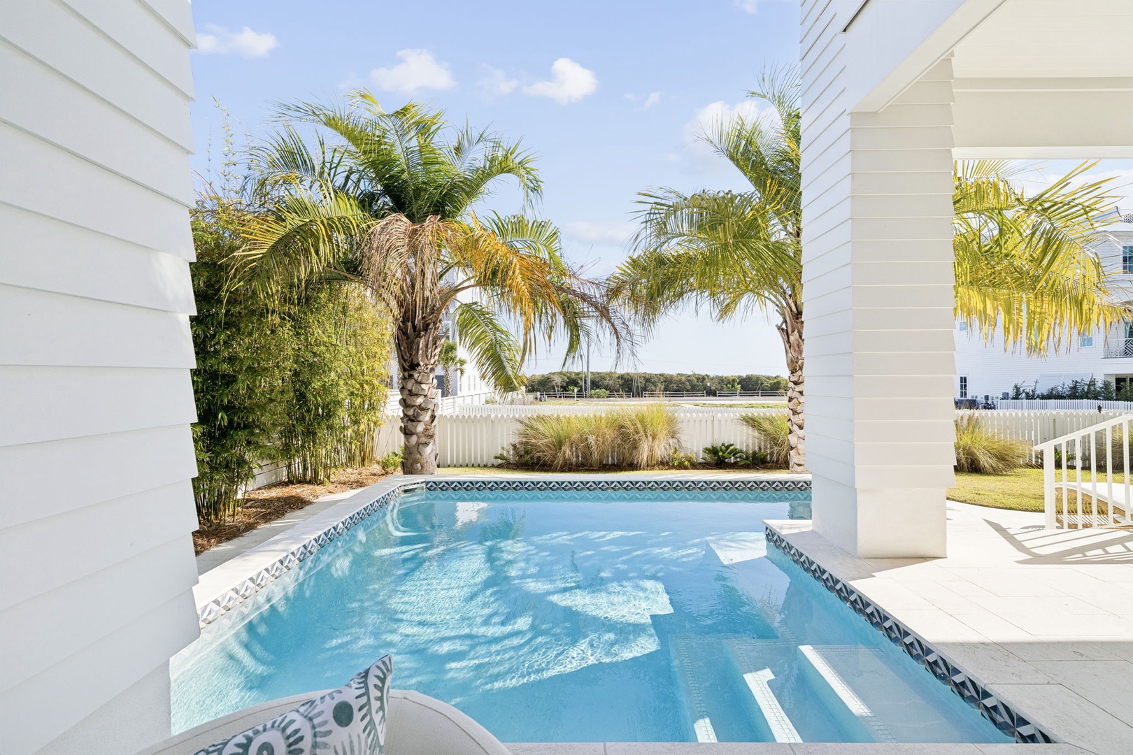 Your private pool sanctuary awaits, surrounded by swaying palms and modern elegance for the perfect tropical escape.