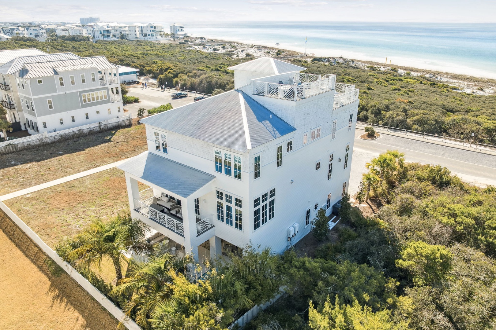 Stunning coastal property showcases modern architecture amid lush natural vegetation, with pristine beaches and turquoise waters just steps away from this elegant retreat.