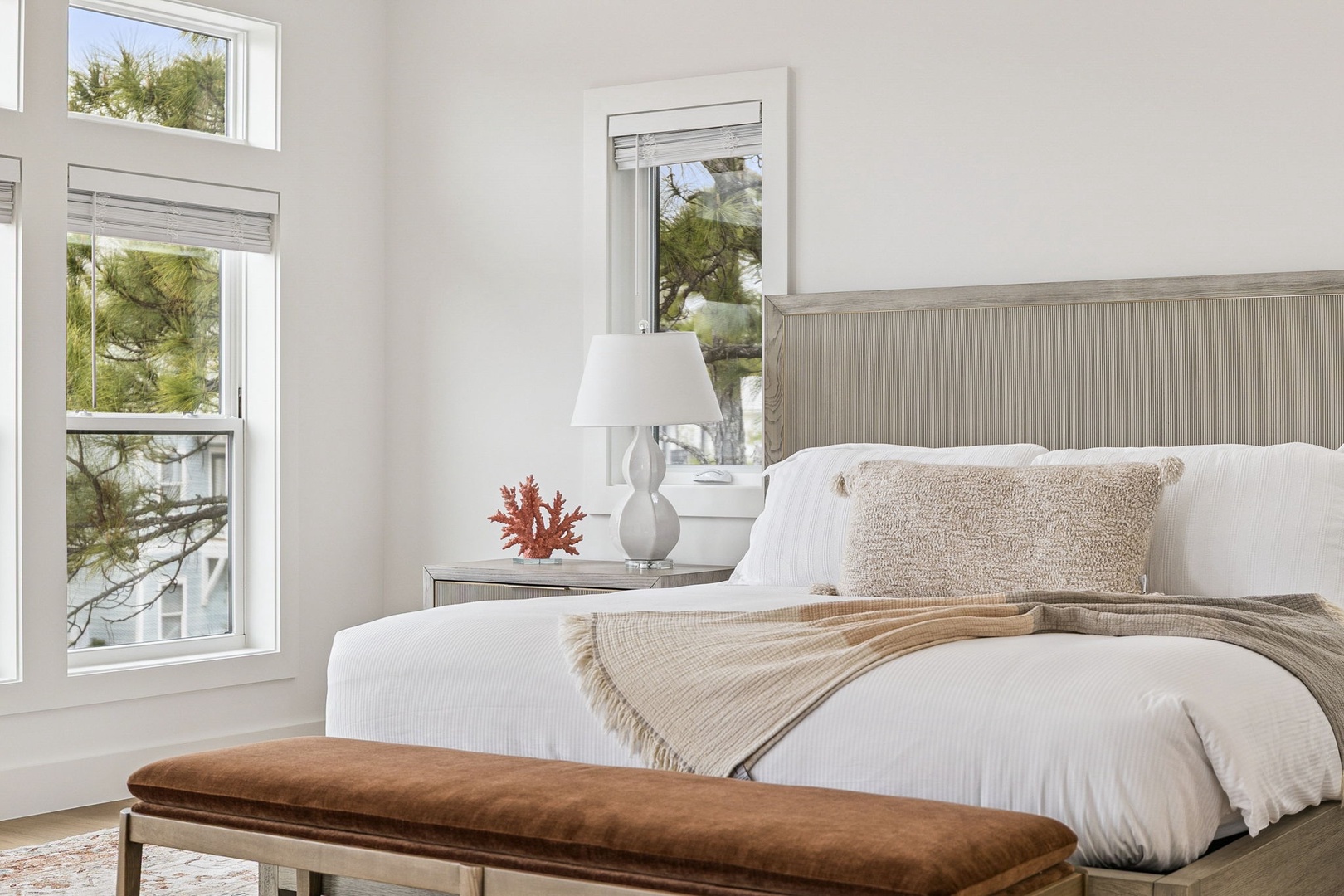 Sink into soft linens and wake to natural light streaming through your windows, framing peaceful garden views.