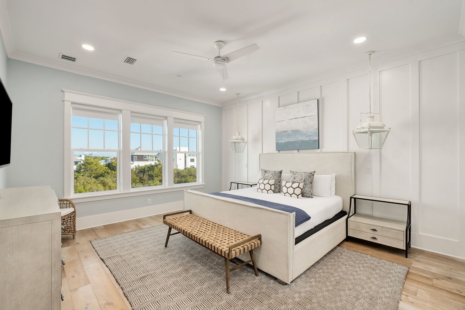 Drift off in this bright coastal bedroom with serene views, crisp linens, and thoughtful touches that create your perfect retreat.