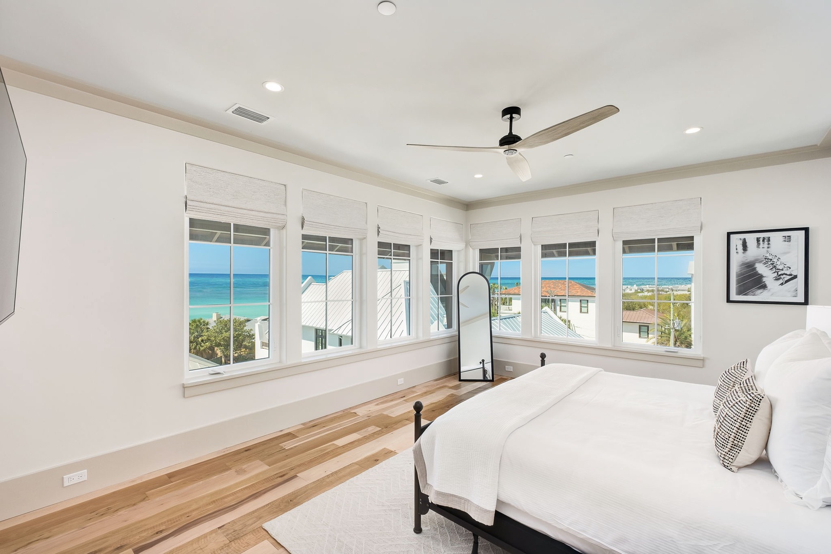 Wake up to stunning ocean views from your bright bedroom, where panoramic windows frame the turquoise sea and pristine coastline perfectly.
